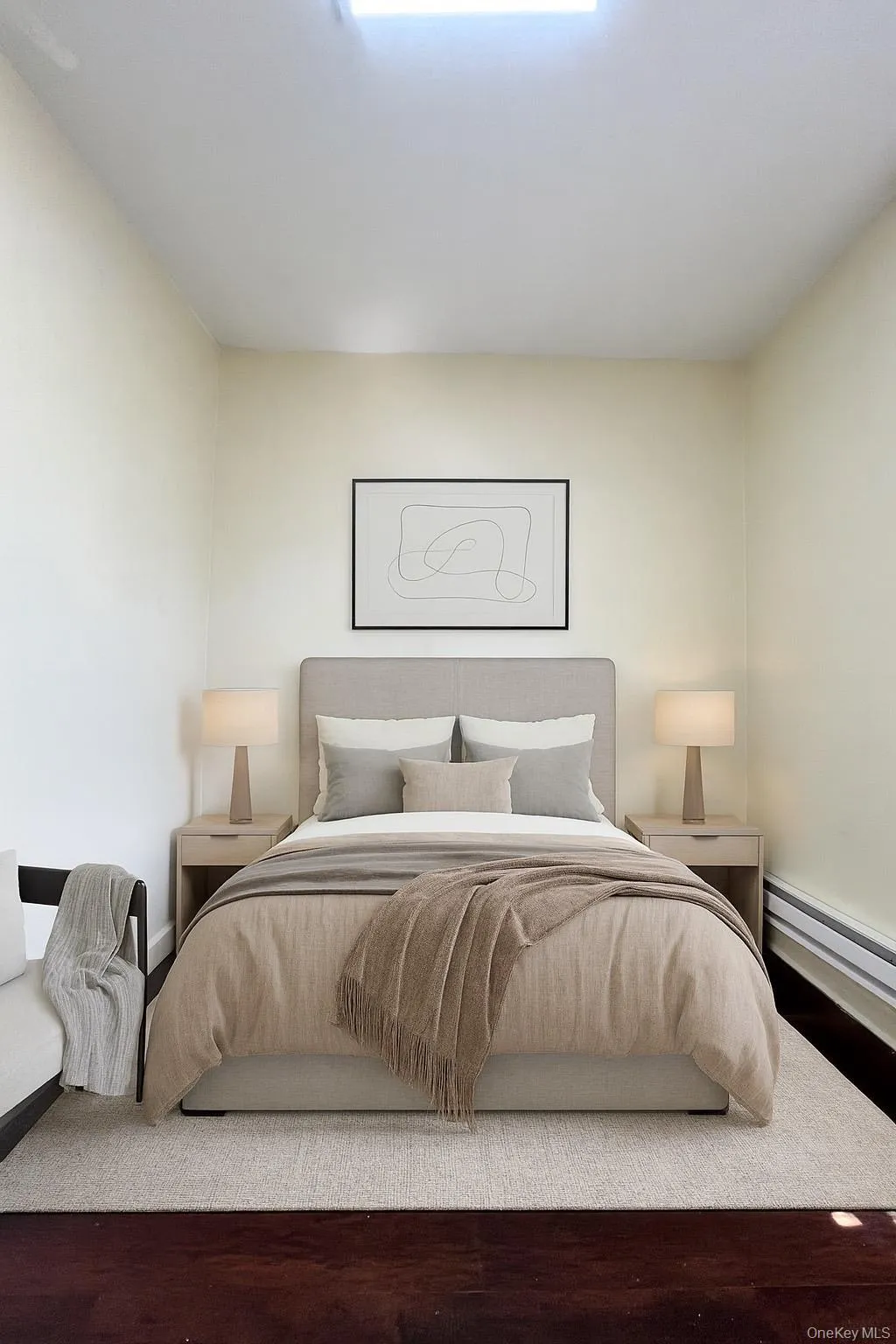 Bedroom #2 with baseboard heating and wood finished floors Bedroom #2 with baseboard heating and wood finished floors