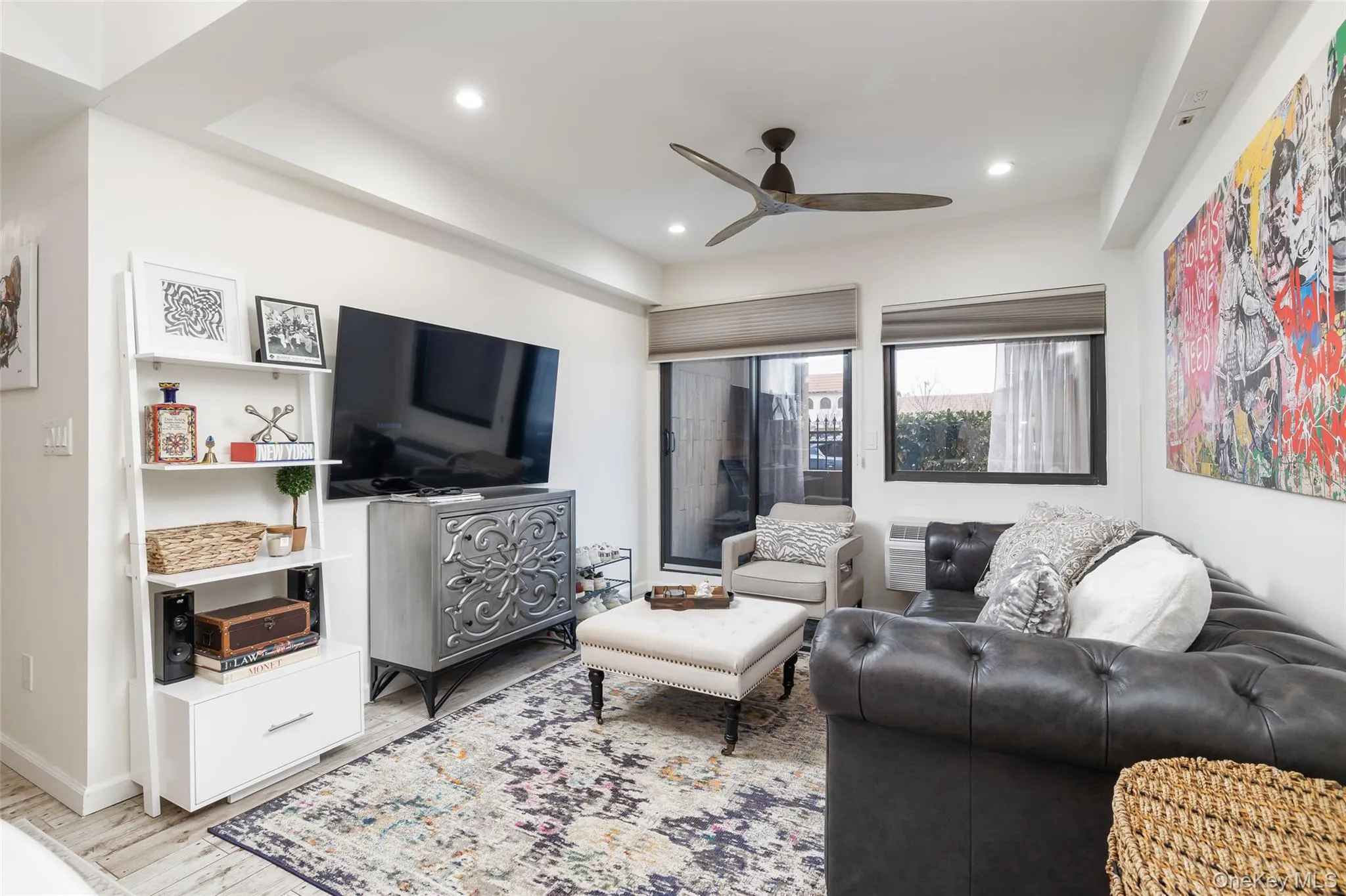 Living room with wood finished floors, ceiling fan, and recessed lighting Living room with wood finished floors, ceiling fan, and recessed lighting