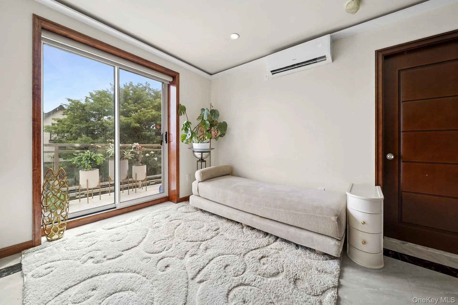 Unfurnished bedroom featuring access to exterior, an AC wall unit, recessed lighting, and tile patterned floors Unfurnished bedroom featuring access to exterior, an AC wall unit, recessed lighting, and tile patterned floors
