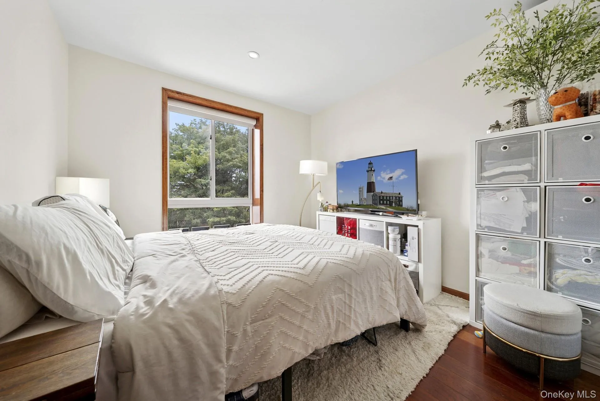 Bedroom with wood finished floors and baseboards Bedroom with wood finished floors and baseboards