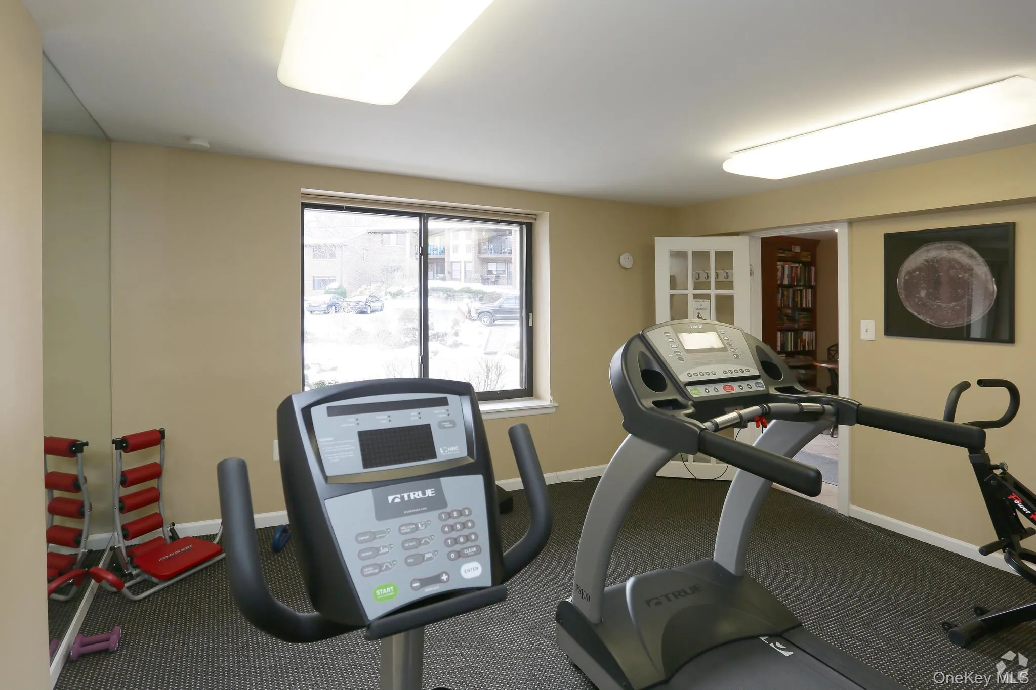 Workout area featuring carpet floors Workout area featuring carpet floors