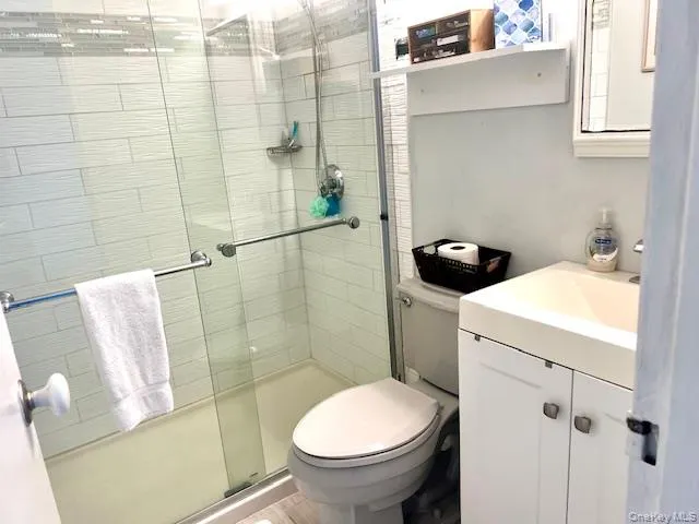 Bathroom with vanity and a stall shower Bathroom with vanity and a stall shower