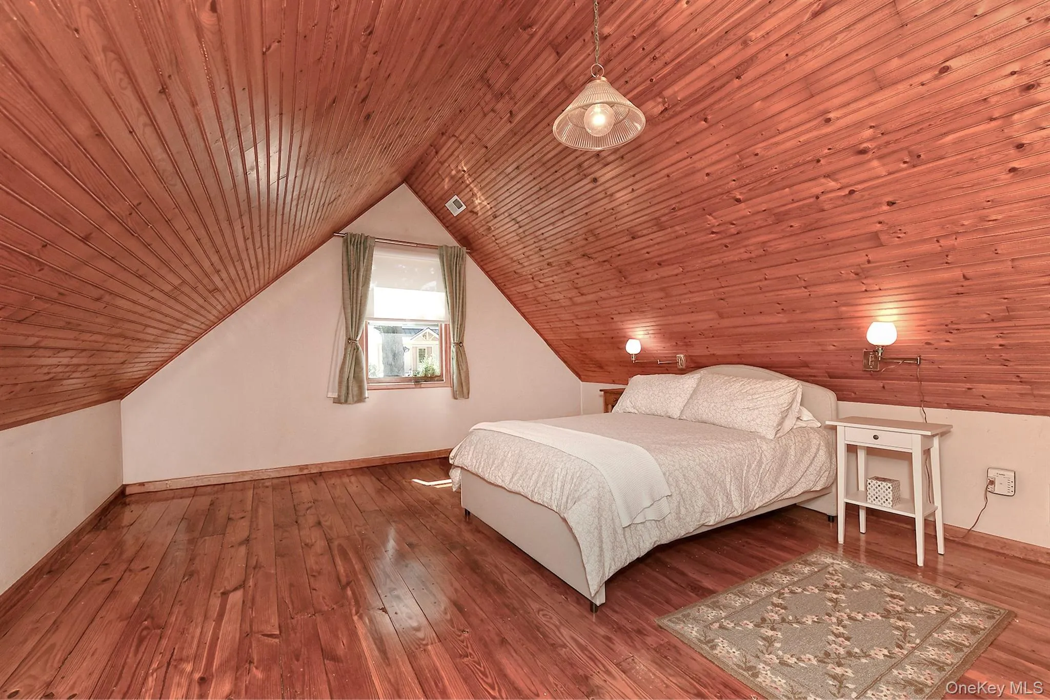 Bedroom featuring wood ceiling, hardwood / wood-style floors, and lofted ceiling Bedroom featuring wood ceiling, hardwood / wood-style floors, and lofted ceiling
