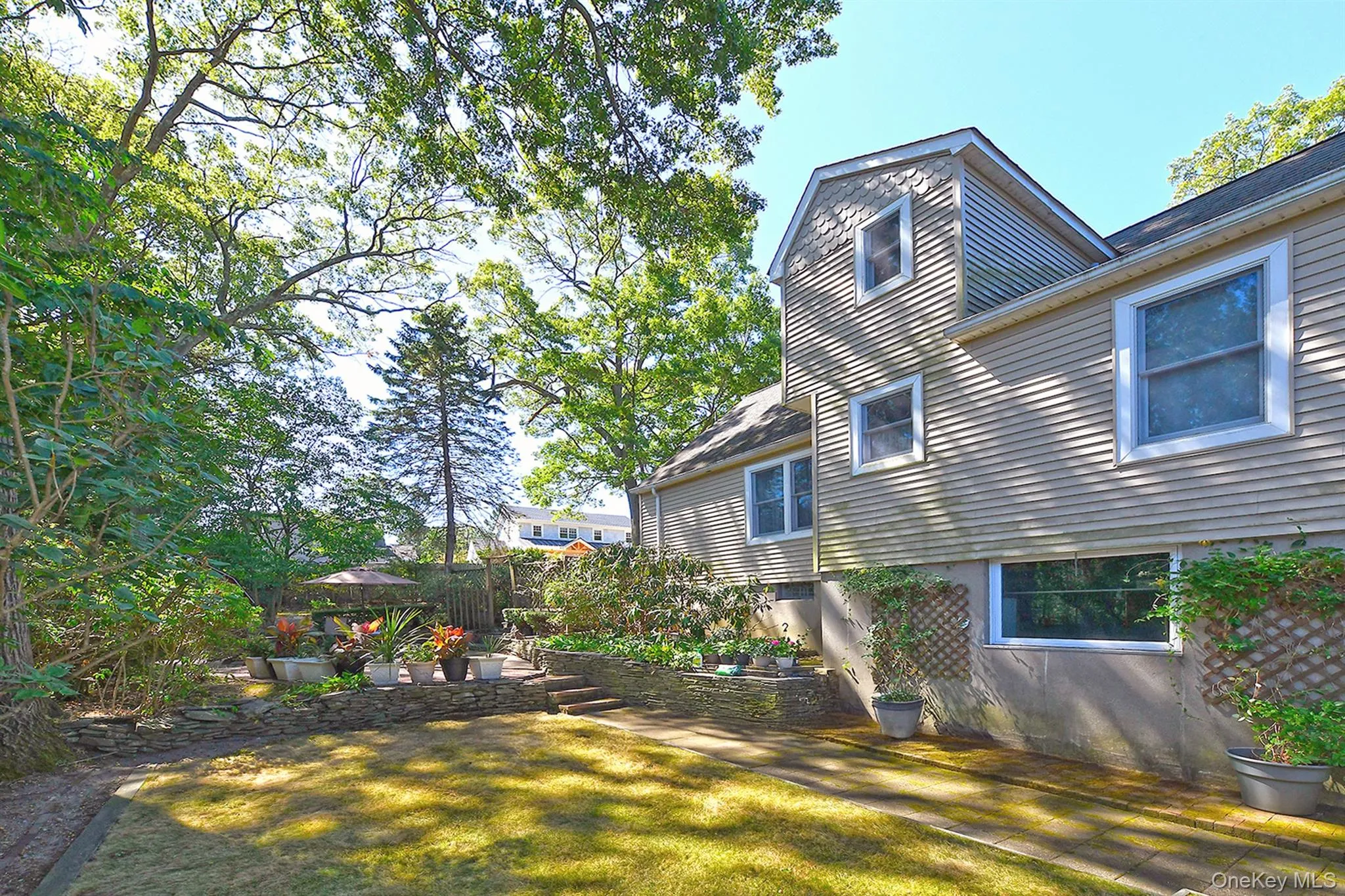 Rear view of property featuring a patio Rear view of property featuring a patio