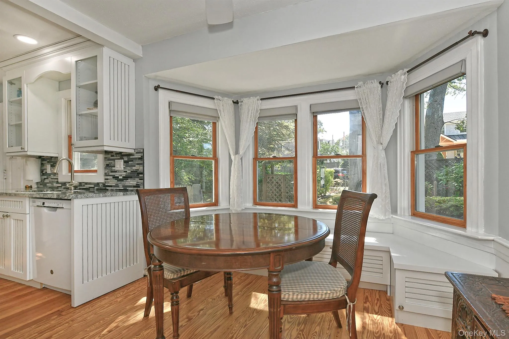 Dining space featuring light wood-style floors Dining space featuring light wood-style floors