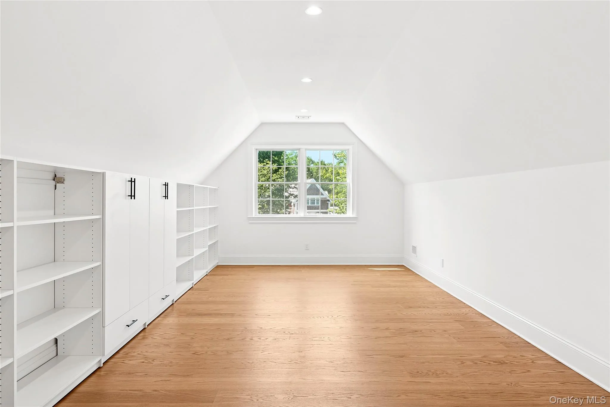 Bonus room with vaulted ceiling, light wood-type flooring, and recessed lighting Bonus room with vaulted ceiling, light wood-type flooring, and recessed lighting