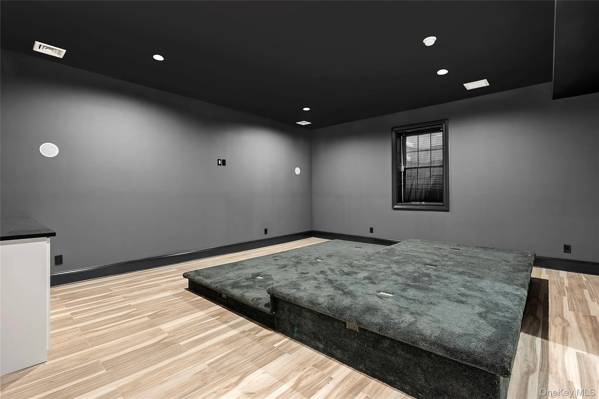 Empty room with light wood-style flooring and recessed lighting Empty room with light wood-style flooring and recessed lighting