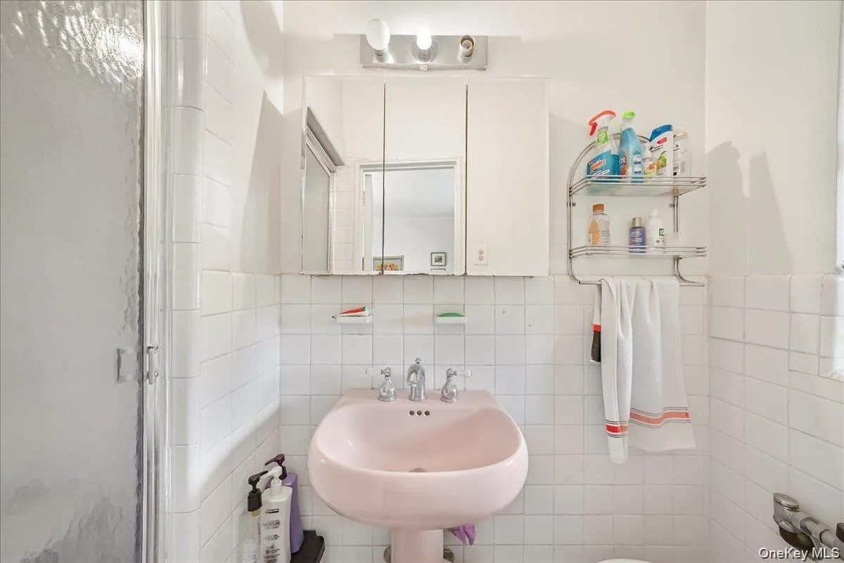 Bathroom featuring tile walls and tasteful backsplash Bathroom featuring tile walls and tasteful backsplash