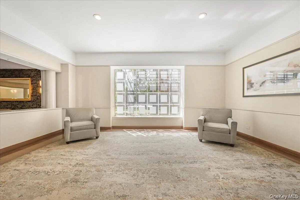 Sitting room featuring baseboards and recessed lighting Sitting room featuring baseboards and recessed lighting
