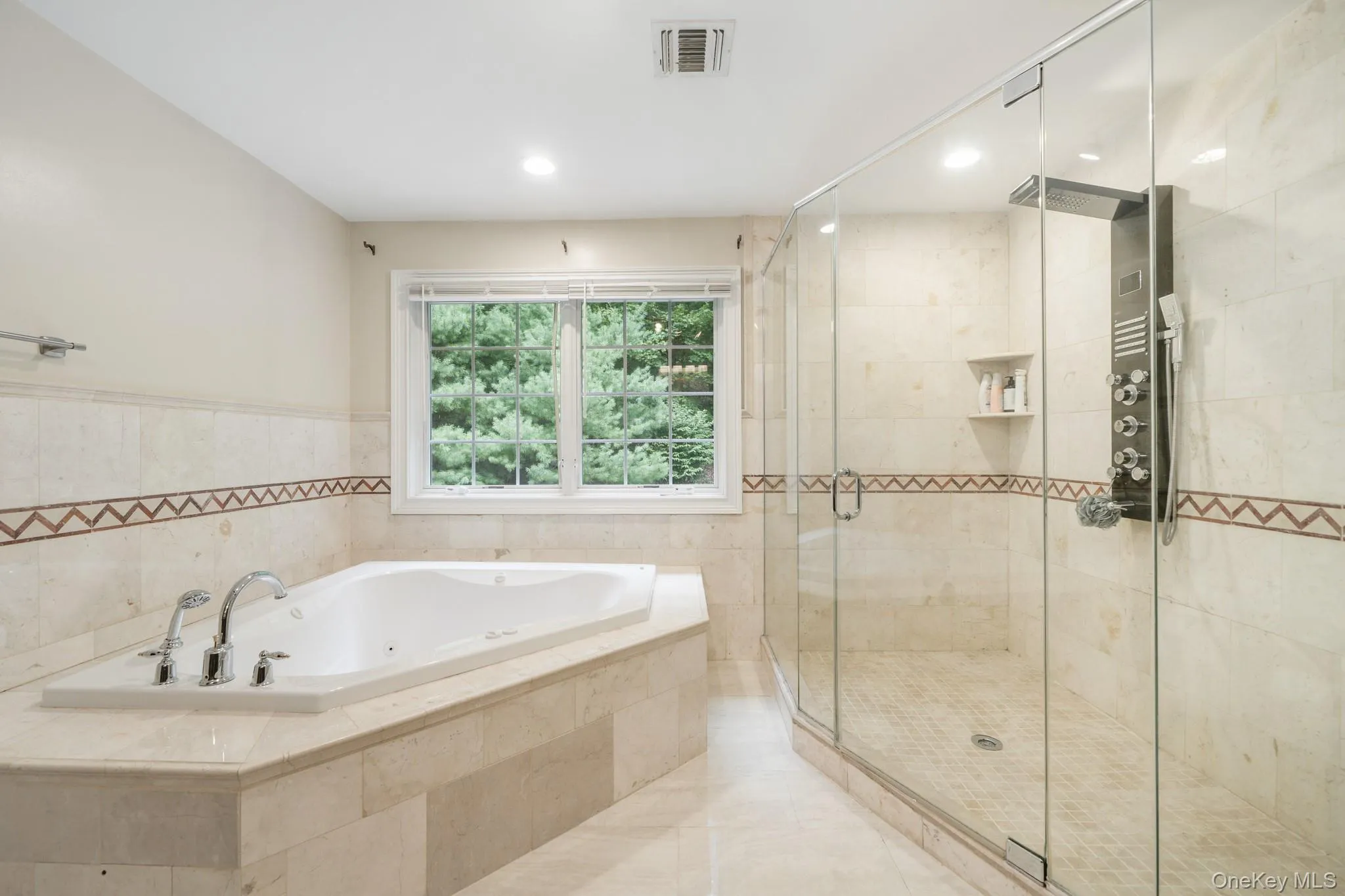 Bathroom with a whirlpool tub, a stall shower, recessed lighting, and tile patterned flooring Bathroom with a whirlpool tub, a stall shower, recessed lighting, and tile patterned flooring