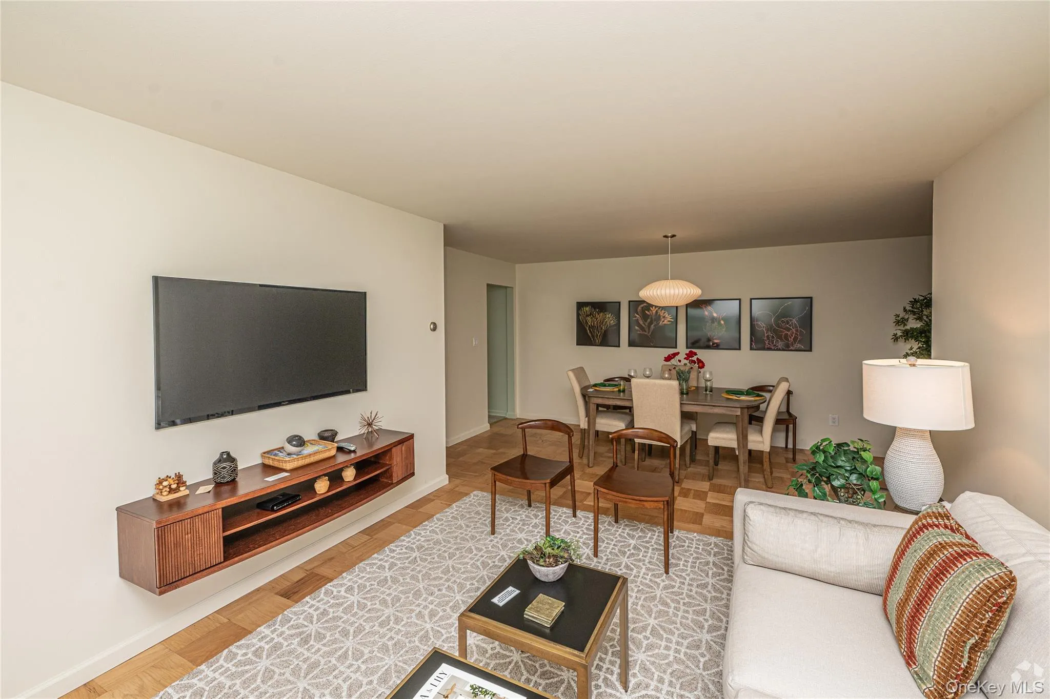 Living room with baseboards and light wood finished floors Living room with baseboards and light wood finished floors