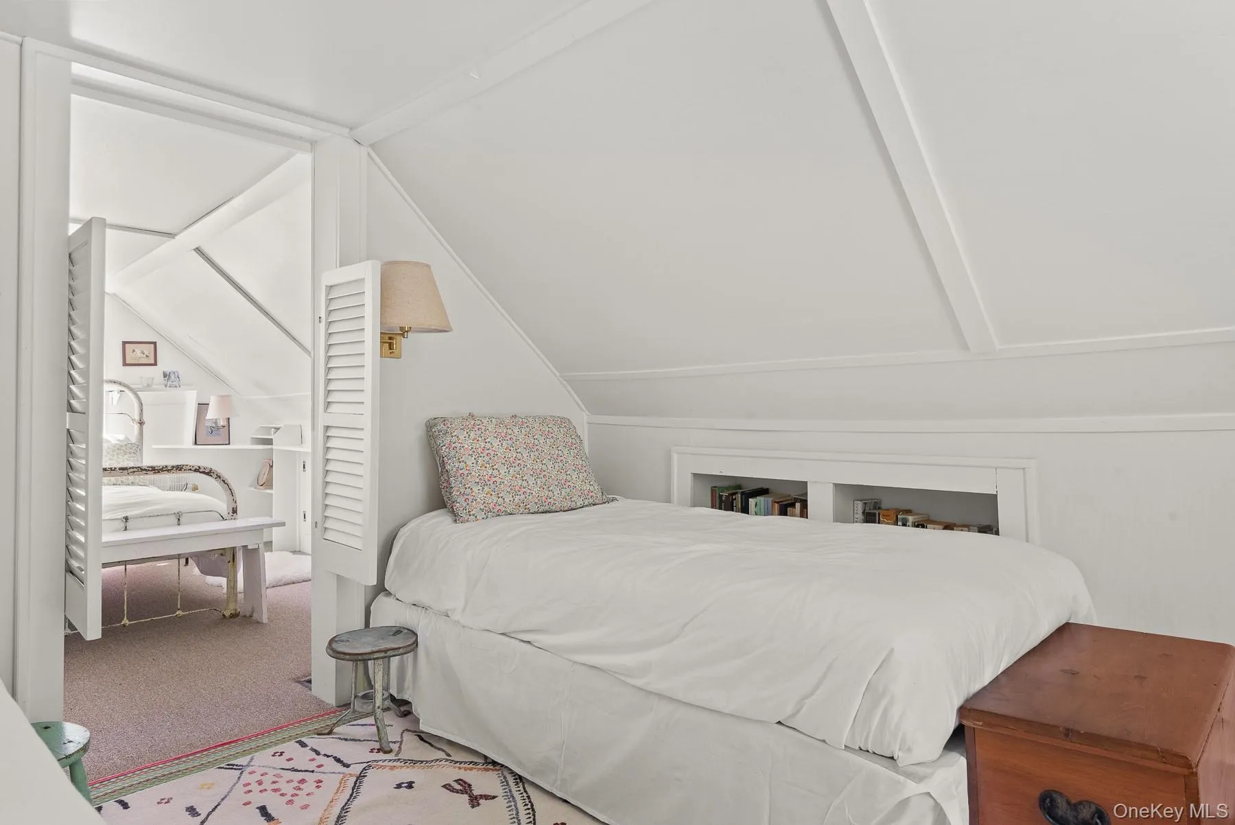 Bedroom with carpet flooring and lofted ceiling Bedroom with carpet flooring and lofted ceiling