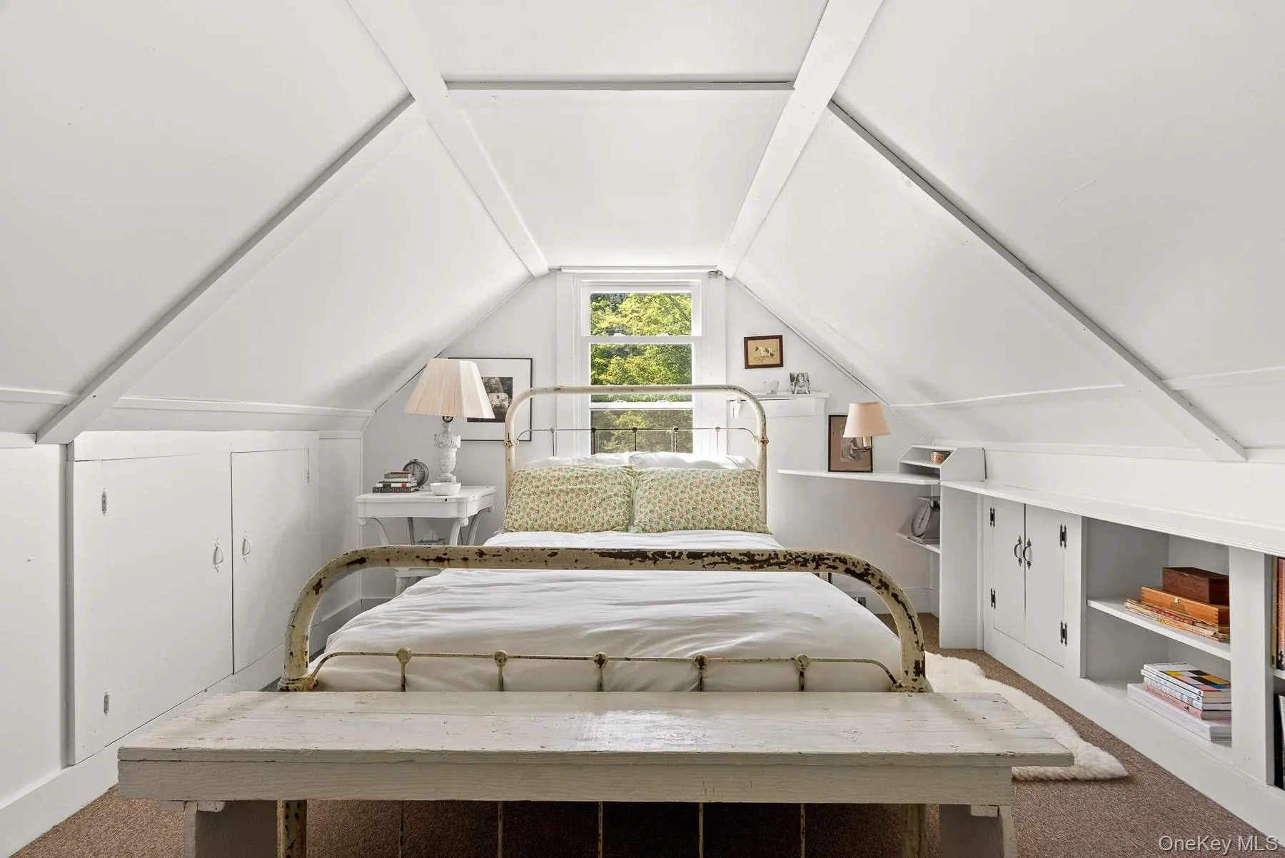 Bedroom featuring carpet floors and vaulted ceiling Bedroom featuring carpet floors and vaulted ceiling