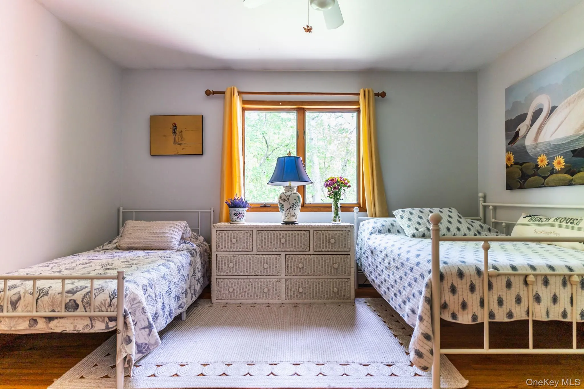 Bedroom with wood finished floors and ceiling fan Bedroom with wood finished floors and ceiling fan