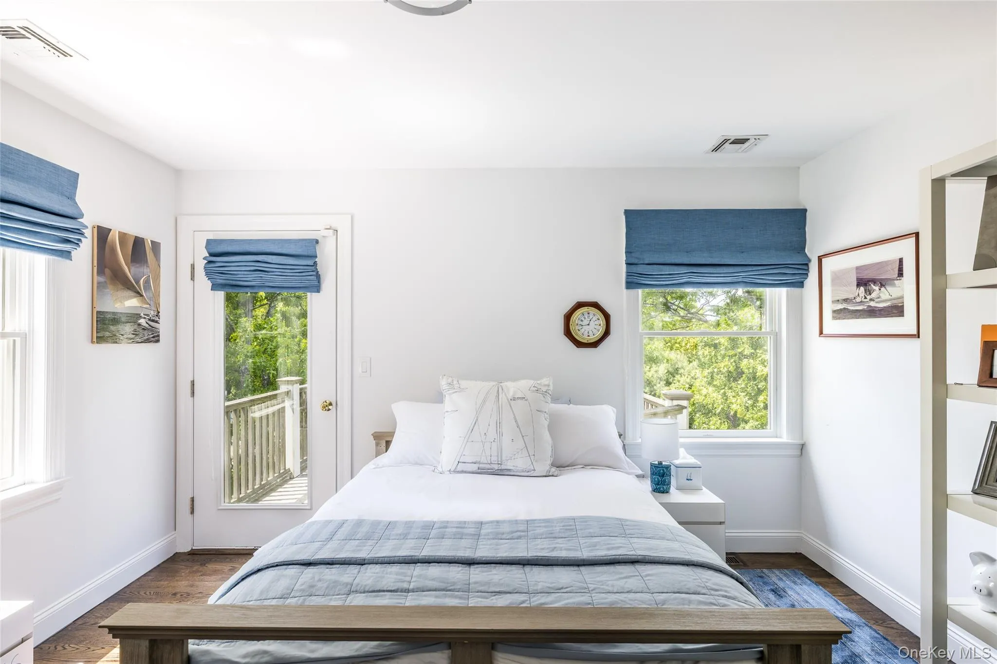 Bedroom with dark wood-type flooring and access to exterior Bedroom with dark wood-type flooring and access to exterior