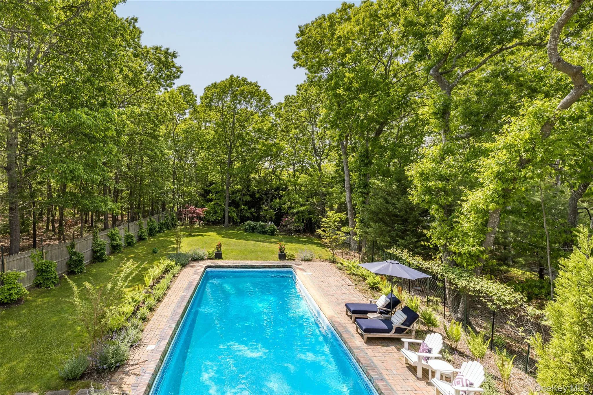 View of swimming pool featuring a patio View of swimming pool featuring a patio