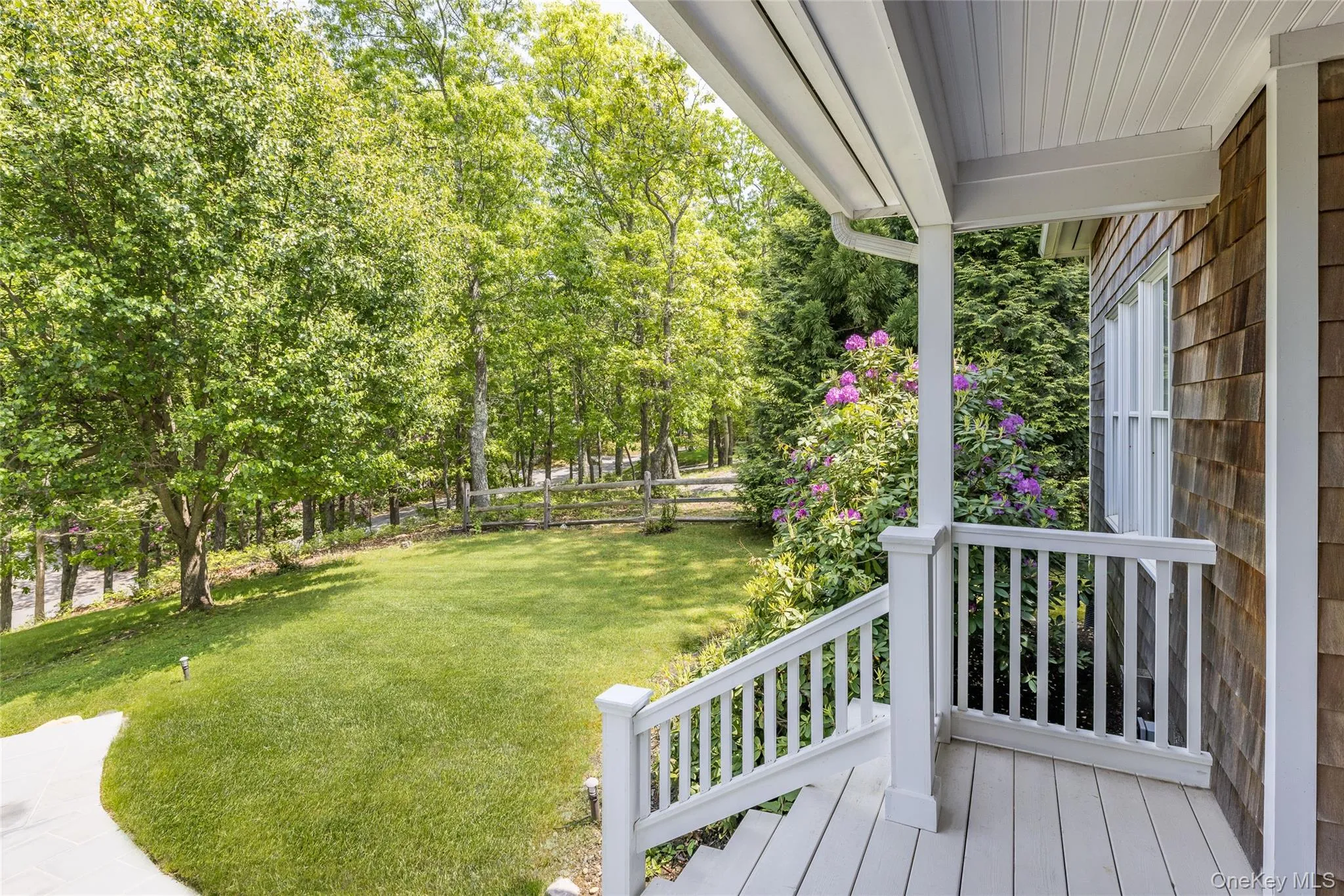 View of yard with a porch View of yard with a porch