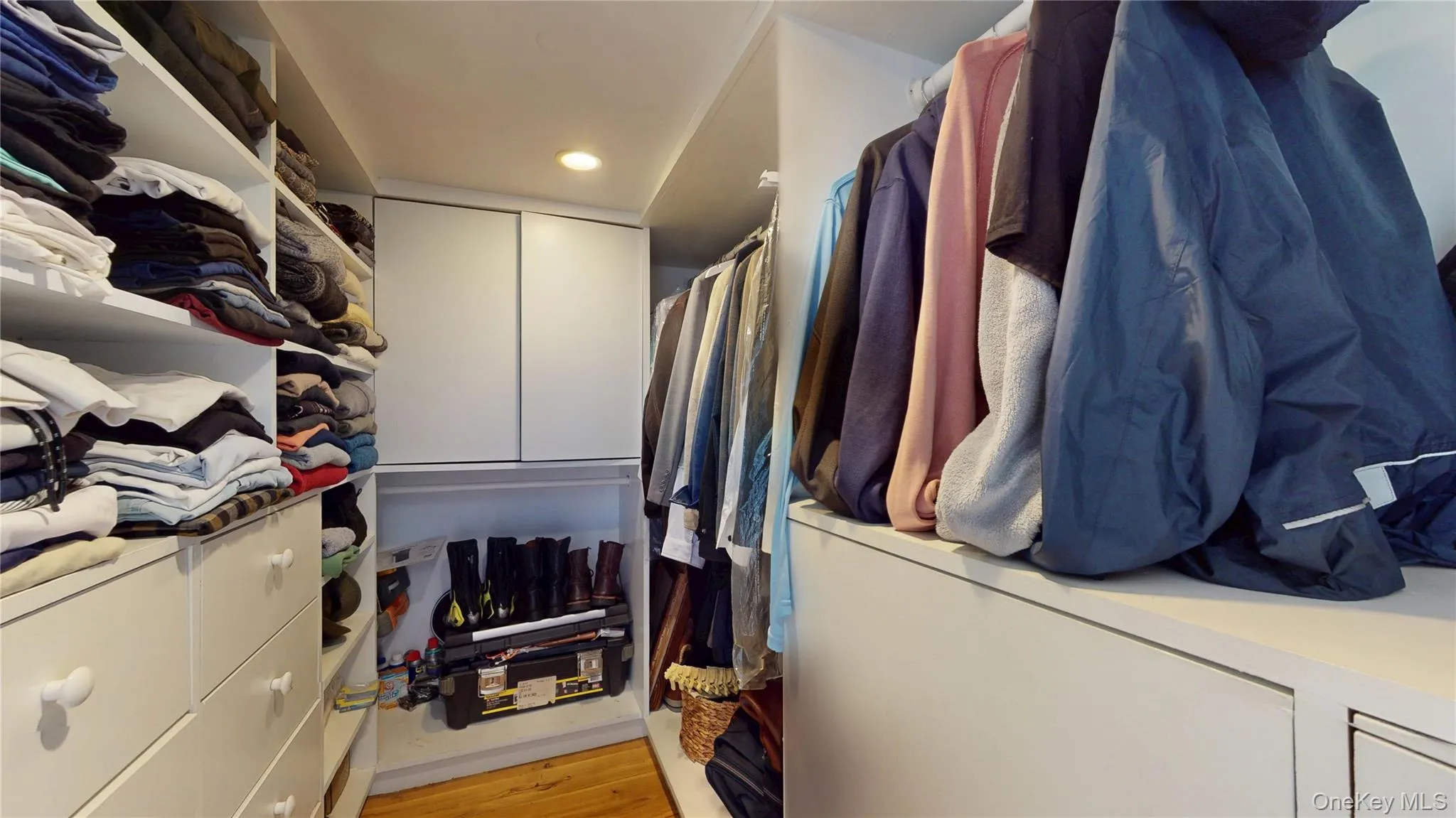 Spacious closet featuring light wood finished floors Spacious closet featuring light wood finished floors