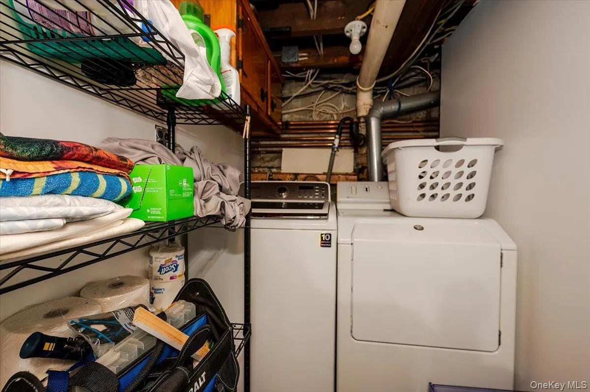 Washroom with washing machine and clothes dryer Washroom with washing machine and clothes dryer