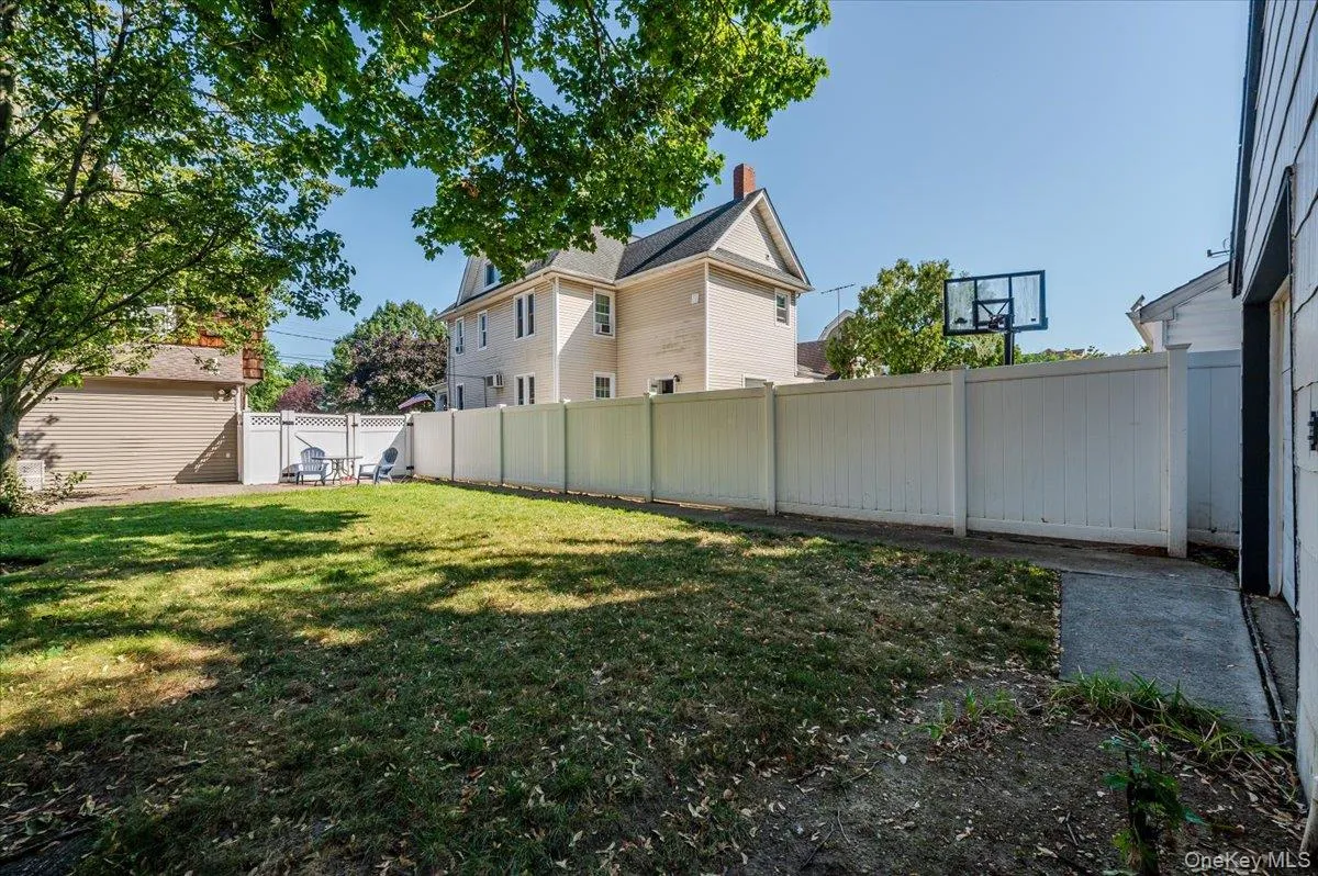 Fenced backyard with a gate Fenced backyard with a gate
