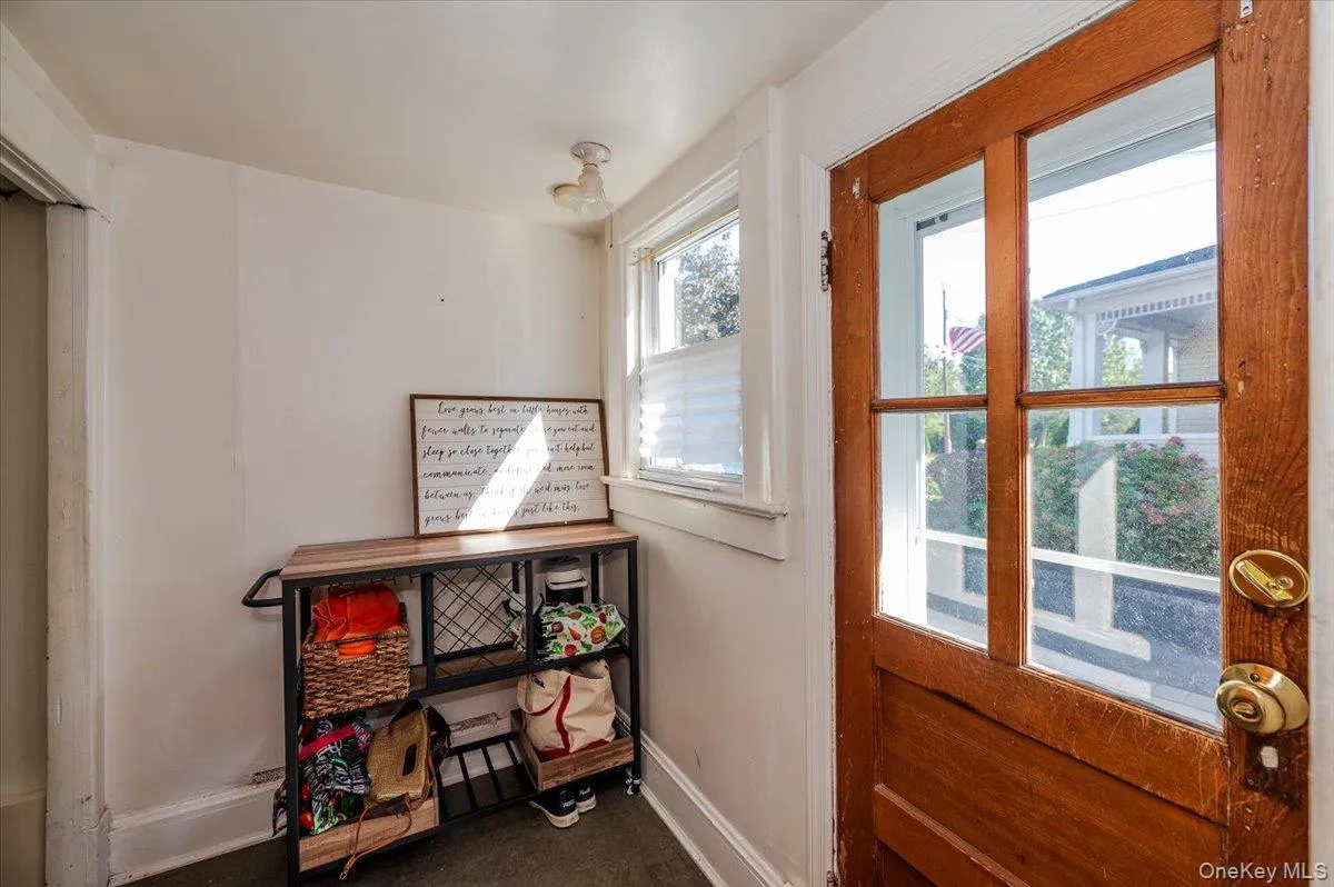 Doorway to outside with baseboards Doorway to outside with baseboards
