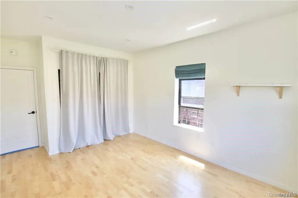 Spare room with light wood finished floors and recessed lighting Spare room with light wood finished floors and recessed lighting