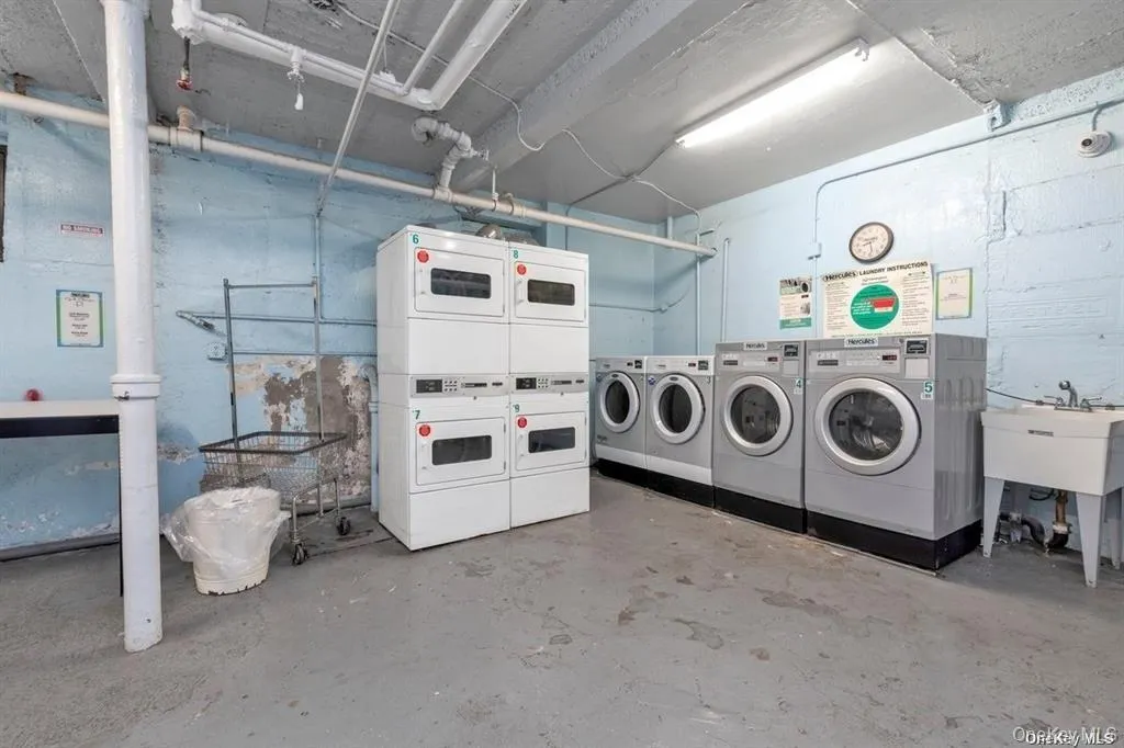 Community laundry with stacked washing machine and dryer Community laundry with stacked washing machine and dryer