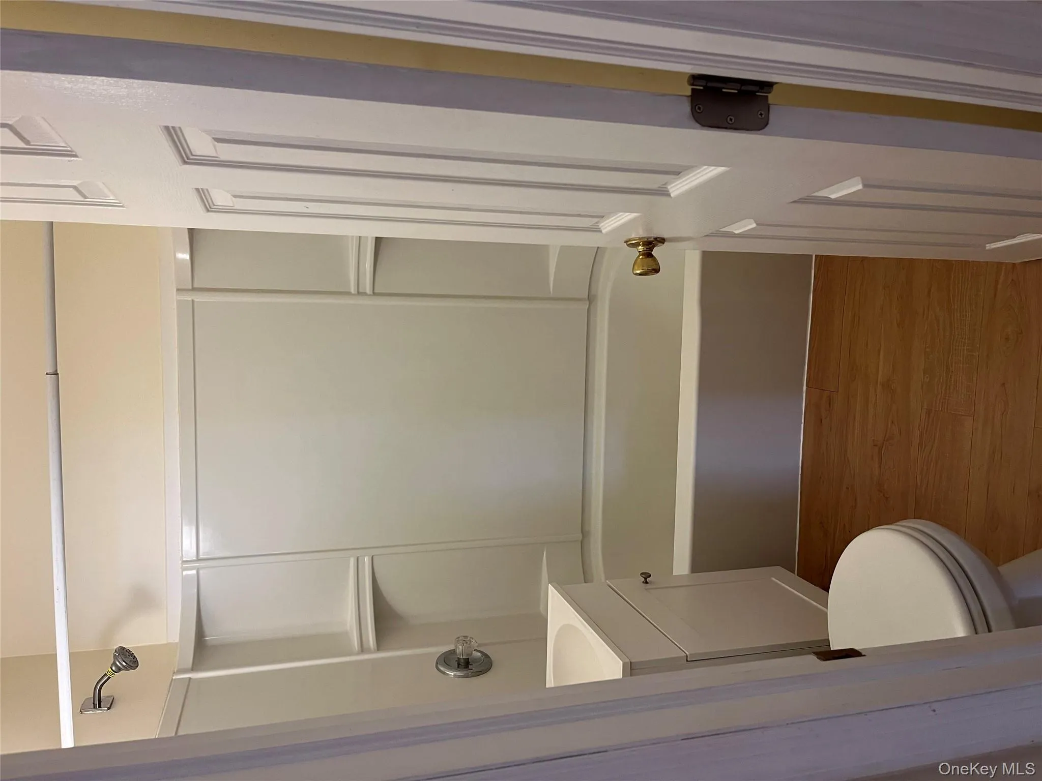 Bathroom with dark wood-style floors, shower / bath combination, and vanity Bathroom with dark wood-style floors, shower / bath combination, and vanity