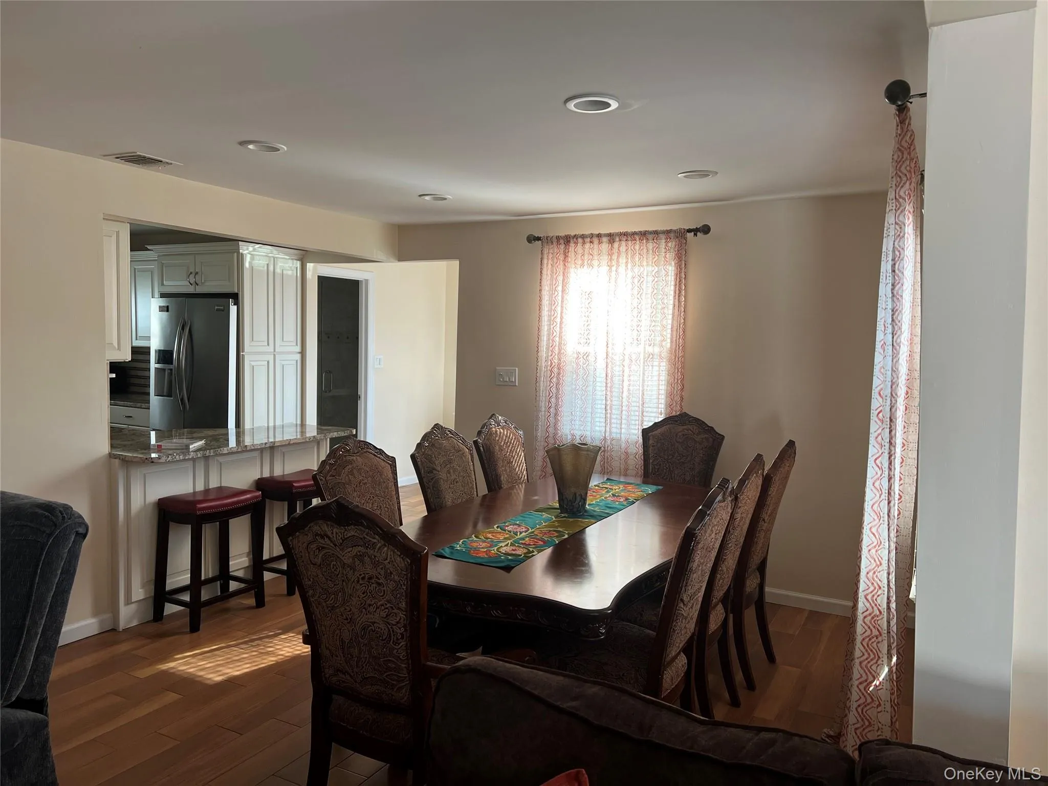 Dining room featuring dark wood finished floors and recessed lighting Dining room featuring dark wood finished floors and recessed lighting