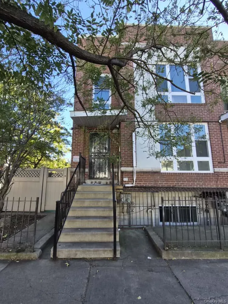 View of front of house with a fenced front yard, brick siding, and a gate View of front of house with a fenced front yard, brick siding, and a gate