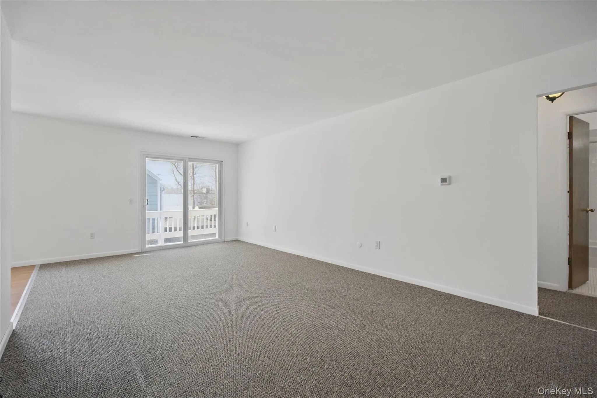 Empty room featuring carpet floors Empty room featuring carpet floors