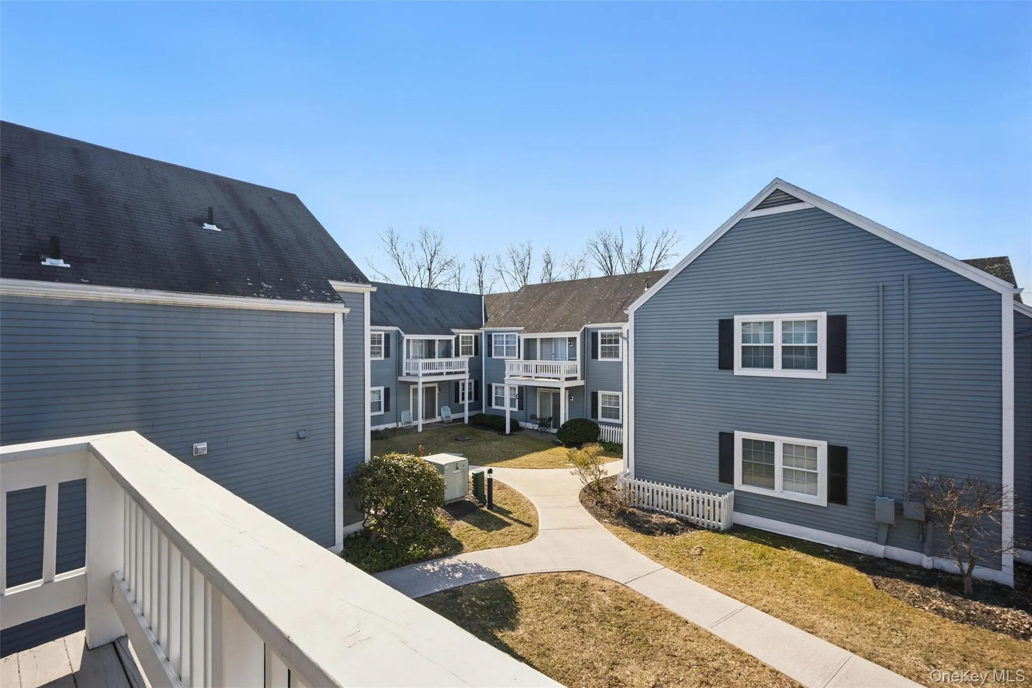 View of home's community featuring a balcony View of home's community featuring a balcony