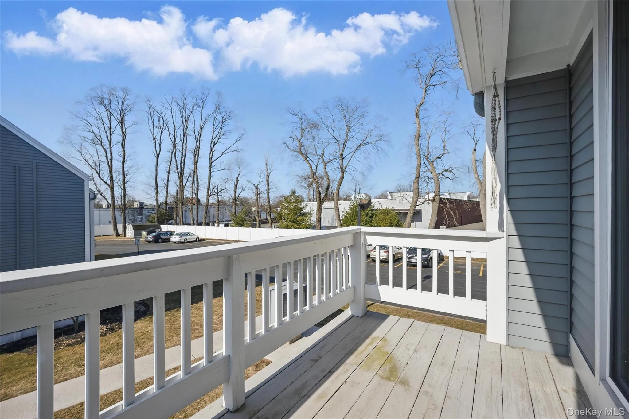 Wooden terrace featuring a residential view Wooden terrace featuring a residential view