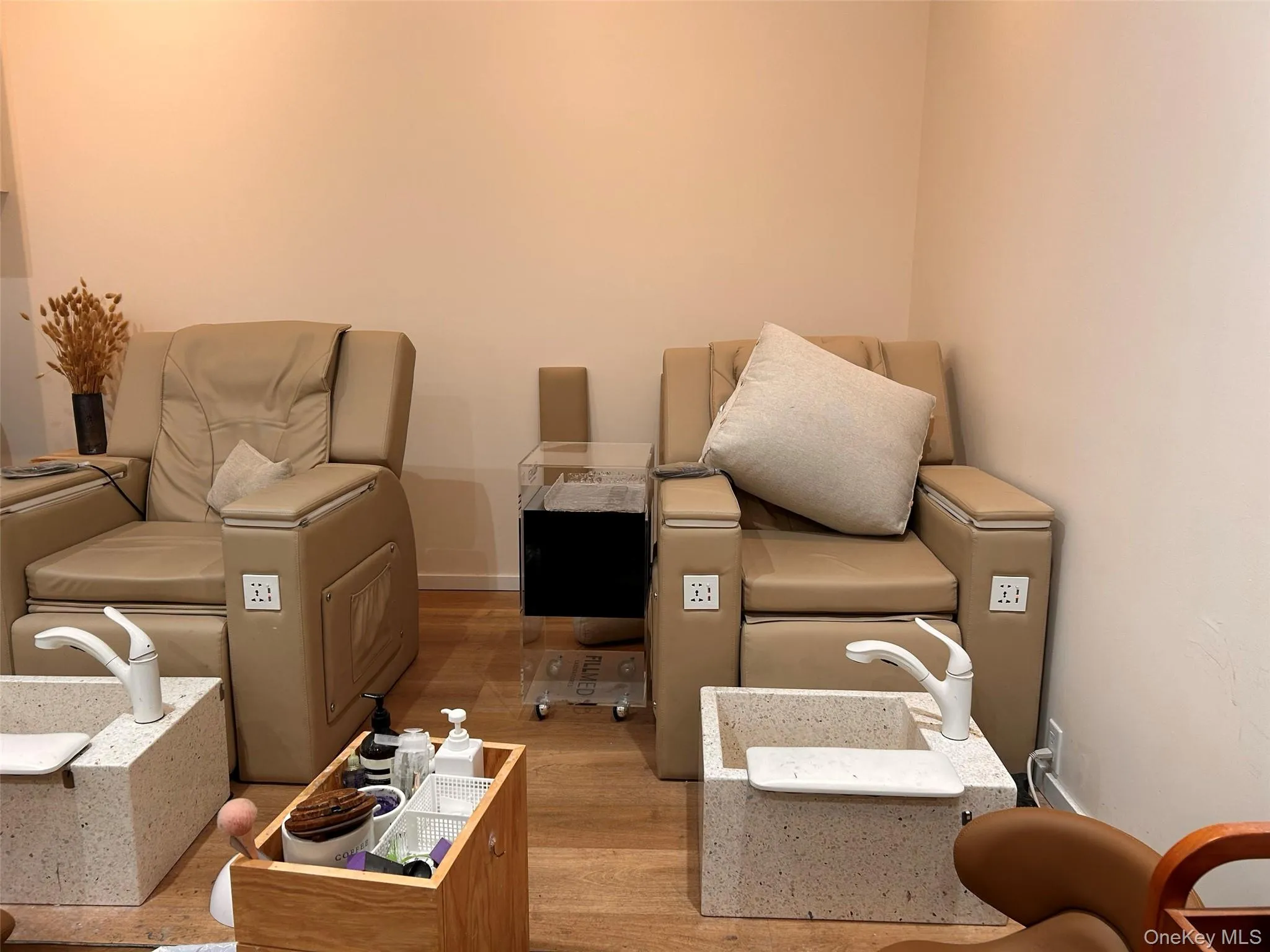 Living area with light wood-style floors and baseboards Living area with light wood-style floors and baseboards