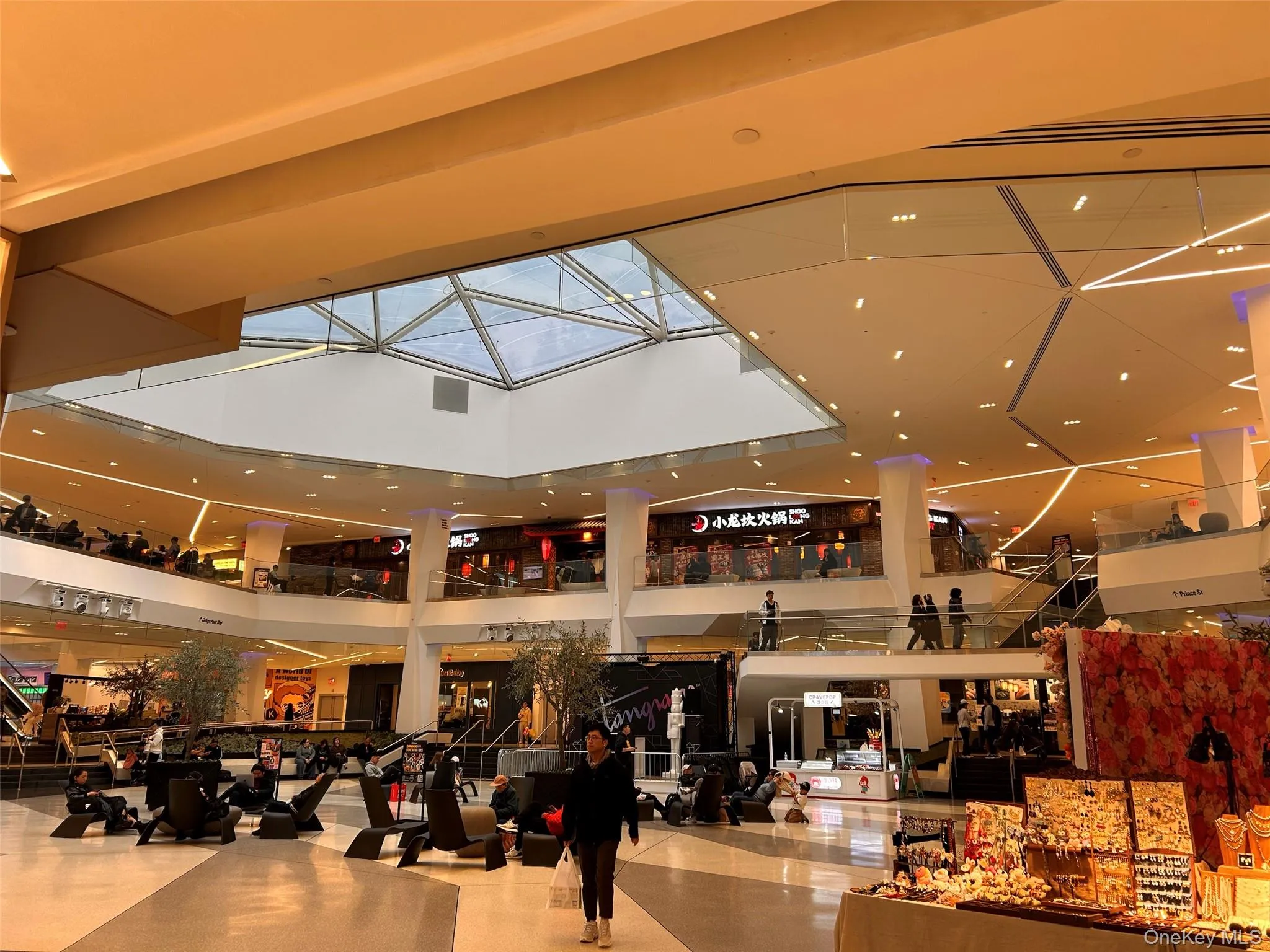 Community lobby with a towering ceiling and recessed lighting Community lobby with a towering ceiling and recessed lighting