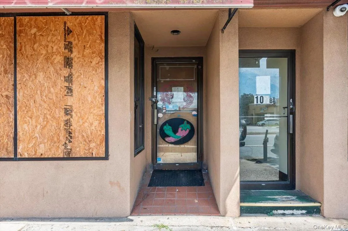View of exterior entry with stucco siding View of exterior entry with stucco siding