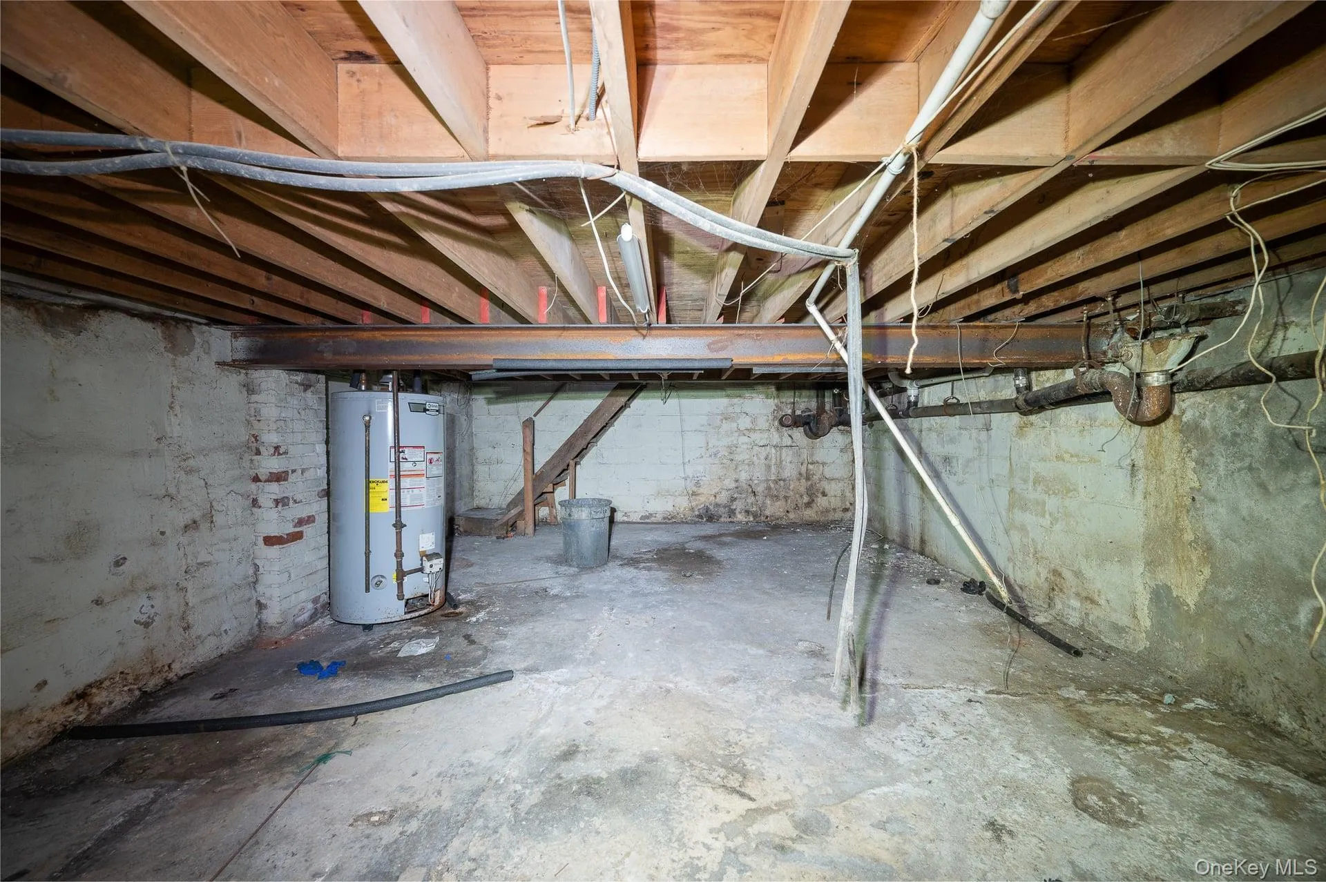 Unfinished basement with gas water heater Unfinished basement with gas water heater