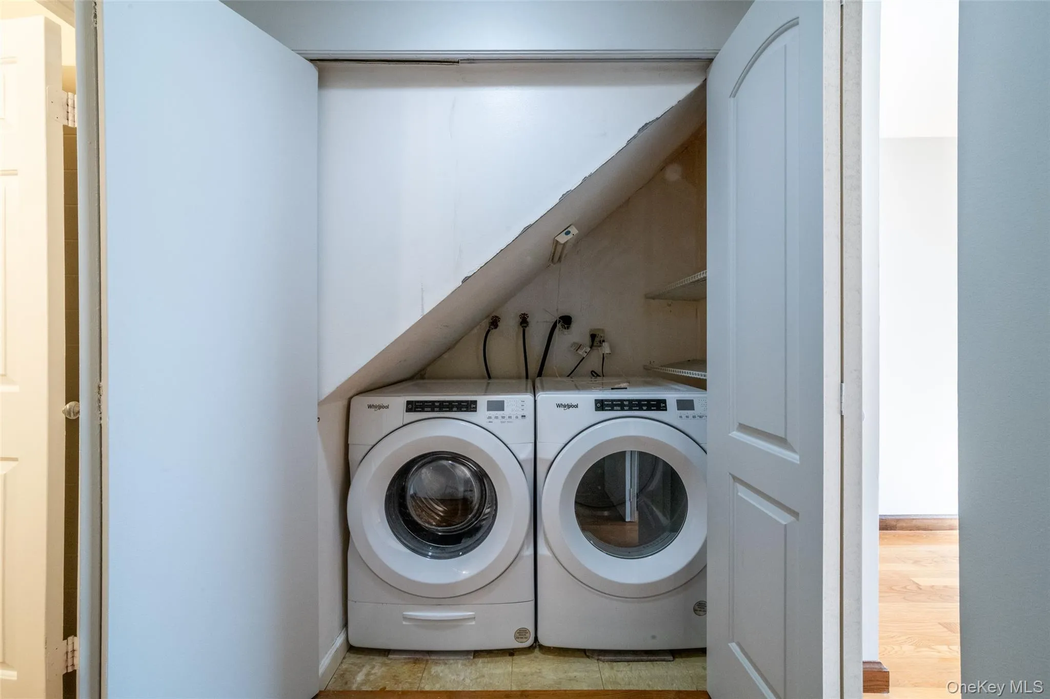 Washroom featuring washing machine and clothes dryer Washroom featuring washing machine and clothes dryer