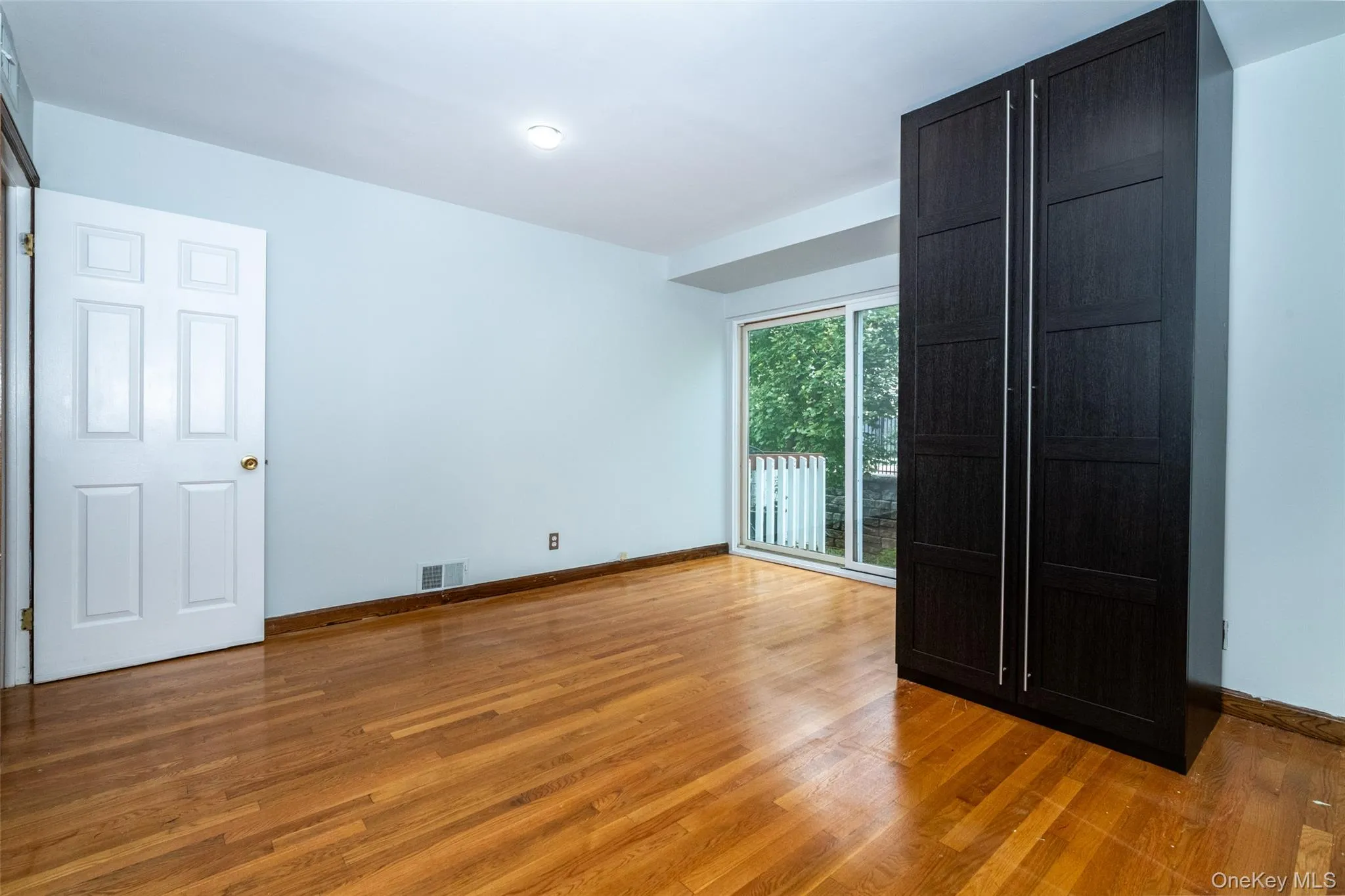second bedroom featuring light hardwood flooring second bedroom featuring light hardwood flooring