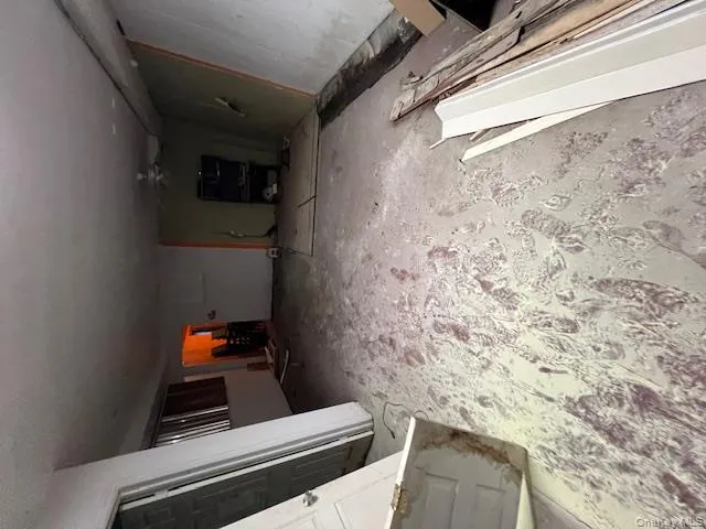 Unfurnished living room featuring a ceiling fan Unfurnished living room featuring a ceiling fan