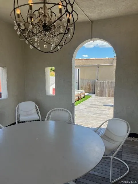 Dining space with a chandelier Dining space with a chandelier