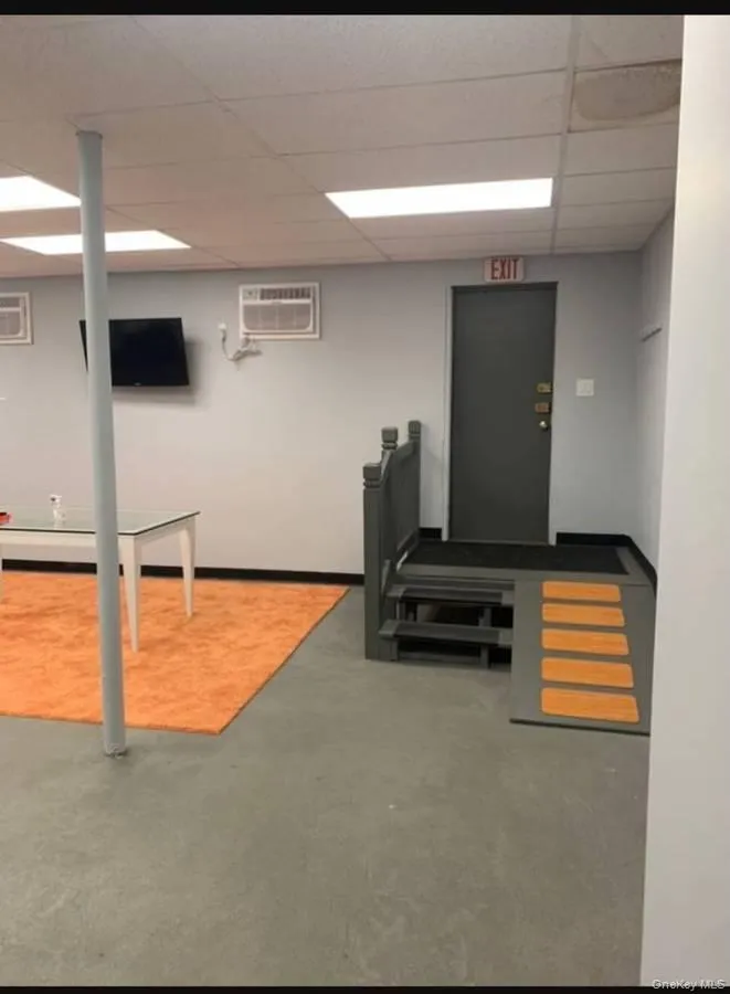 Exercise room featuring a drop ceiling Exercise room featuring a drop ceiling