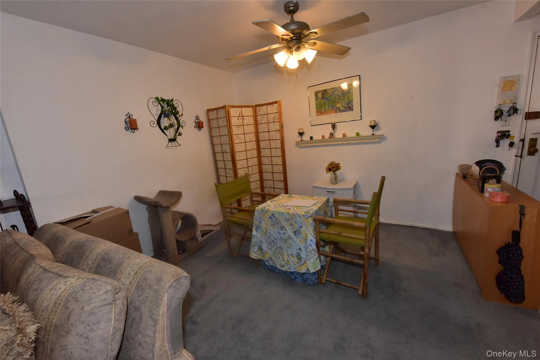 Dining room with dark carpet and ceiling fan Dining room with dark carpet and ceiling fan