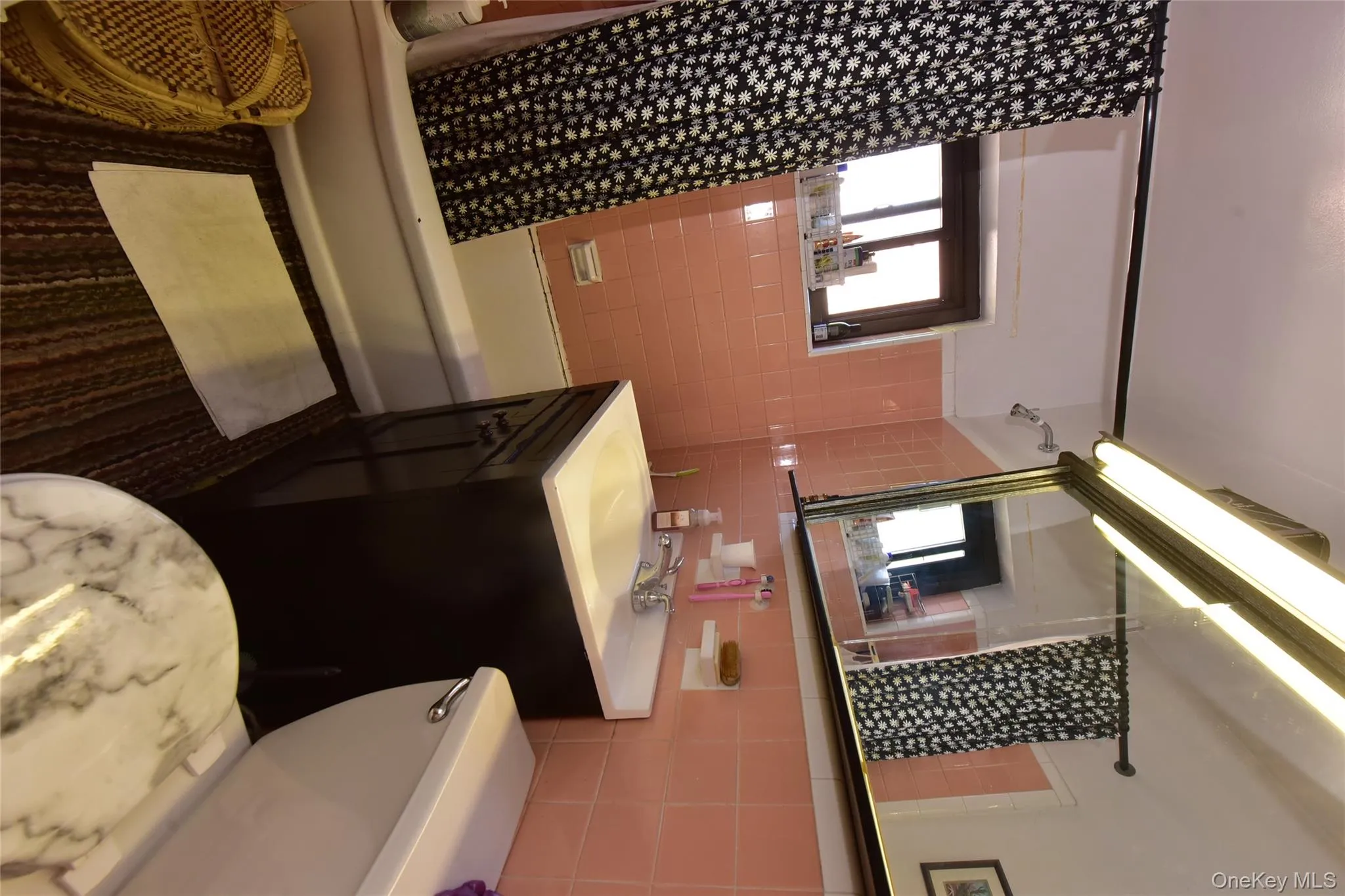 Bathroom with shower / bathtub combination with curtain, tile walls, and vanity Bathroom with shower / bathtub combination with curtain, tile walls, and vanity