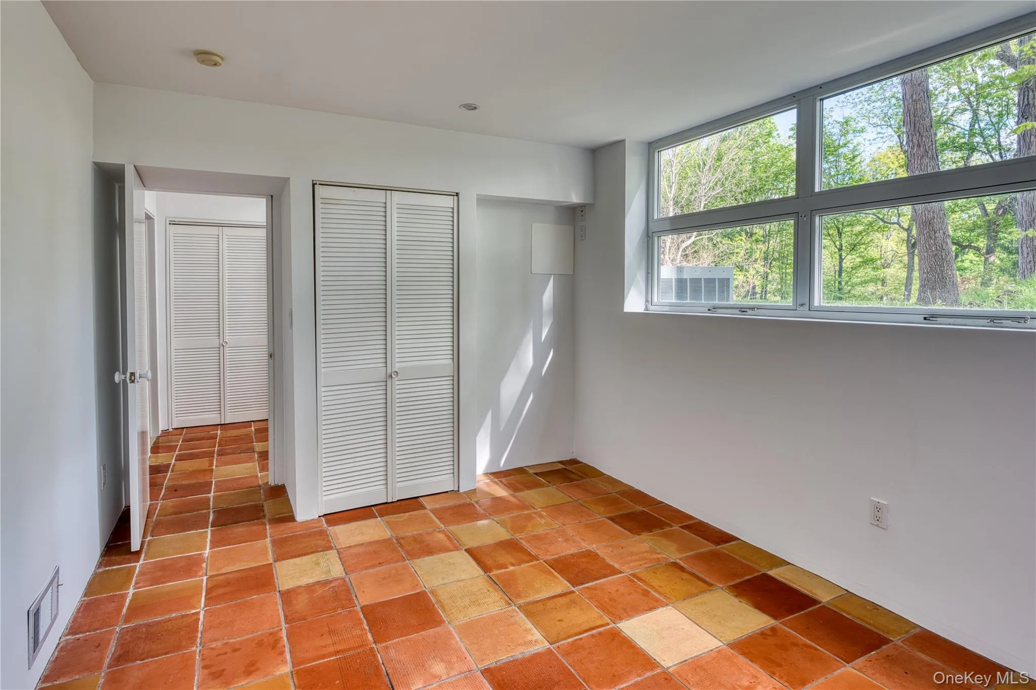 Lower Level BR, ceramic floors and closet. Doorway to 2nd Bath Lower Level BR, ceramic floors and closet. Doorway to 2nd Bath