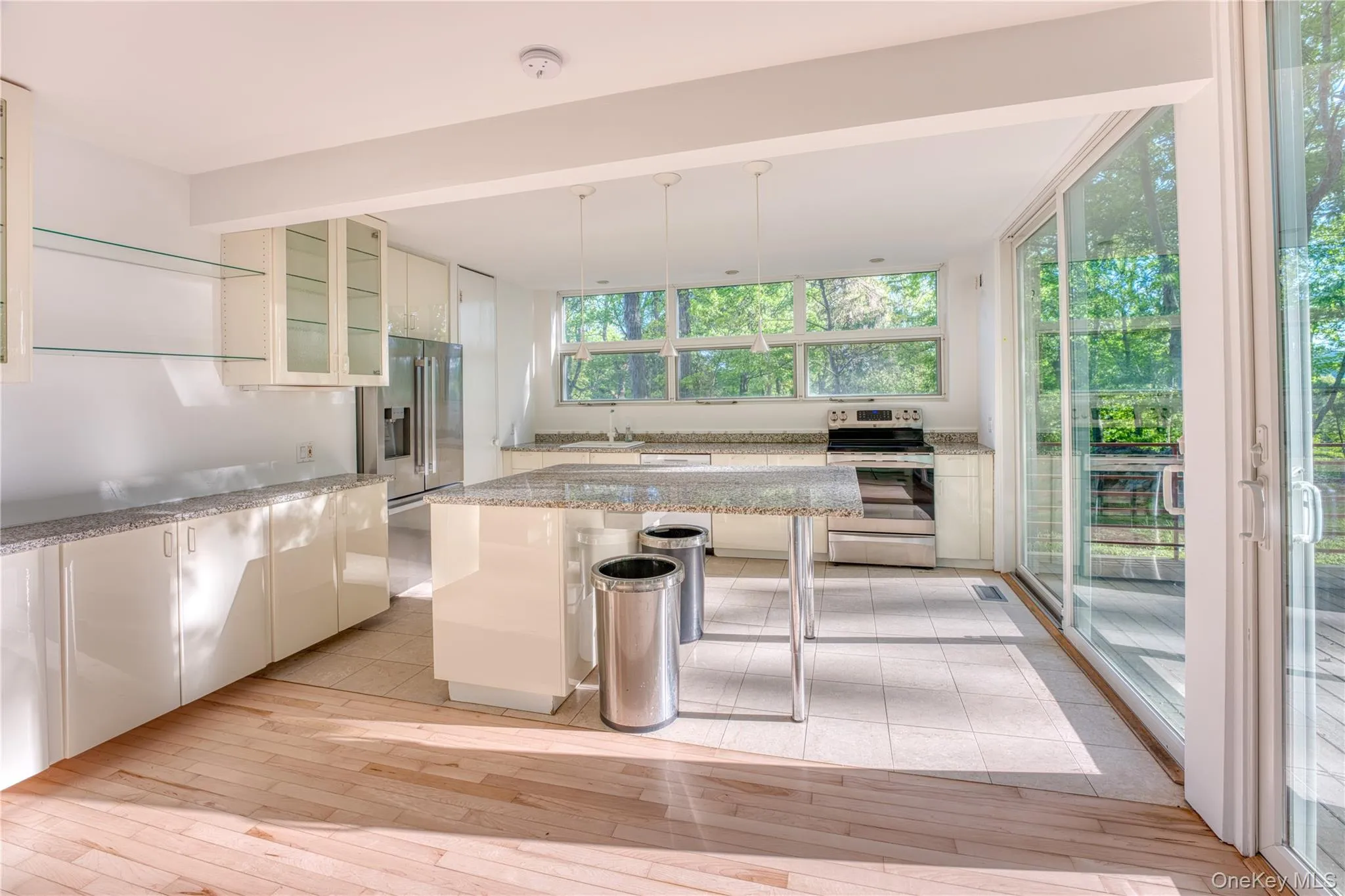 Kitchen with Granite Countertops, Granite countertop Island, Convention Oven, Dishwasher, Refrigerator, Sliding Glass doors to deck, Refinished Hardwood Floors Kitchen with Granite Countertops, Granite countertop Island, Convention Oven, Dishwasher, Refrigerator, Sliding Glass doors to deck, Refinished Hardwood Floors