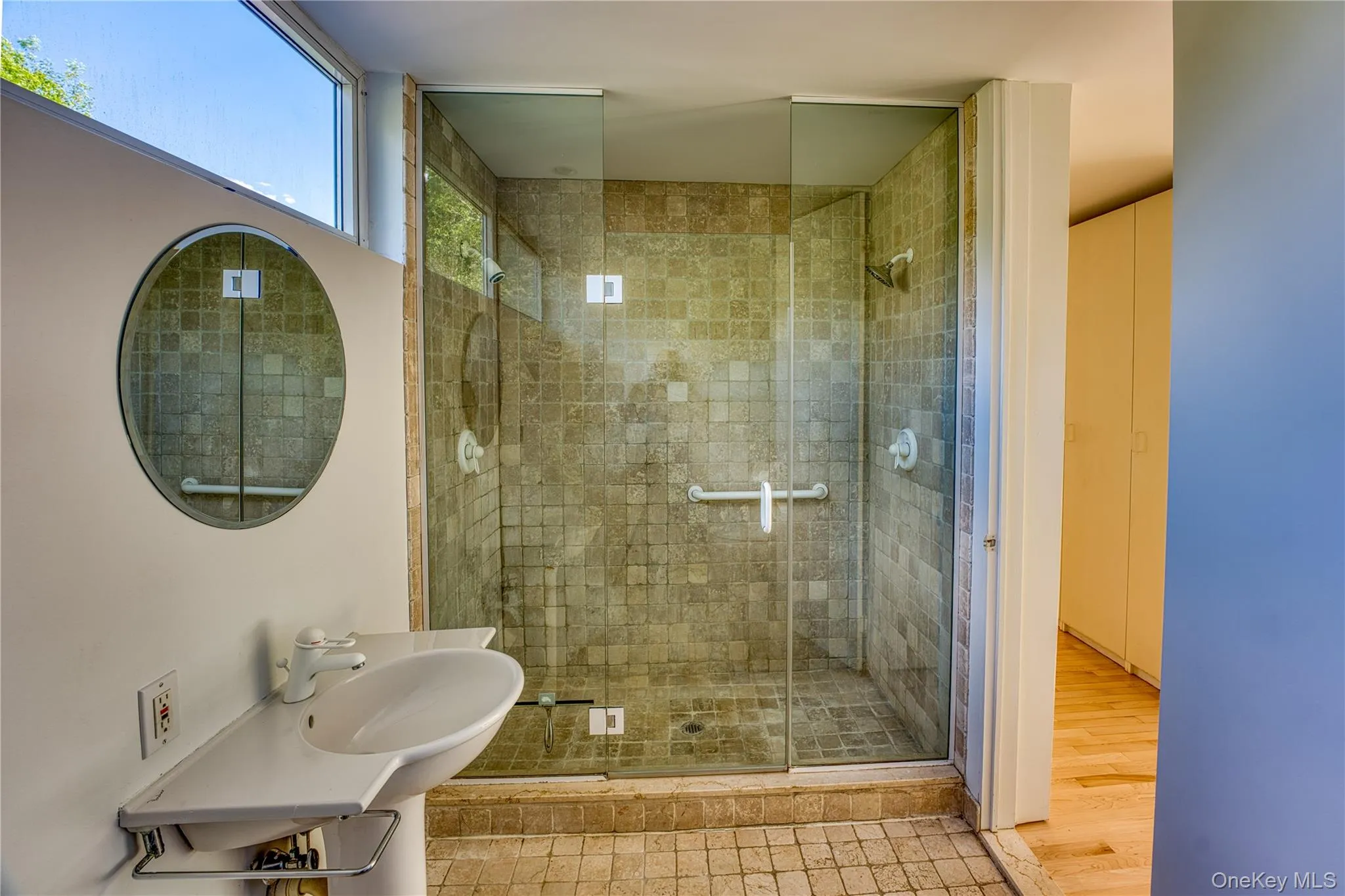 Primary Bath with Tumbled Marble Shower, Floor, Sink Primary Bath with Tumbled Marble Shower, Floor, Sink