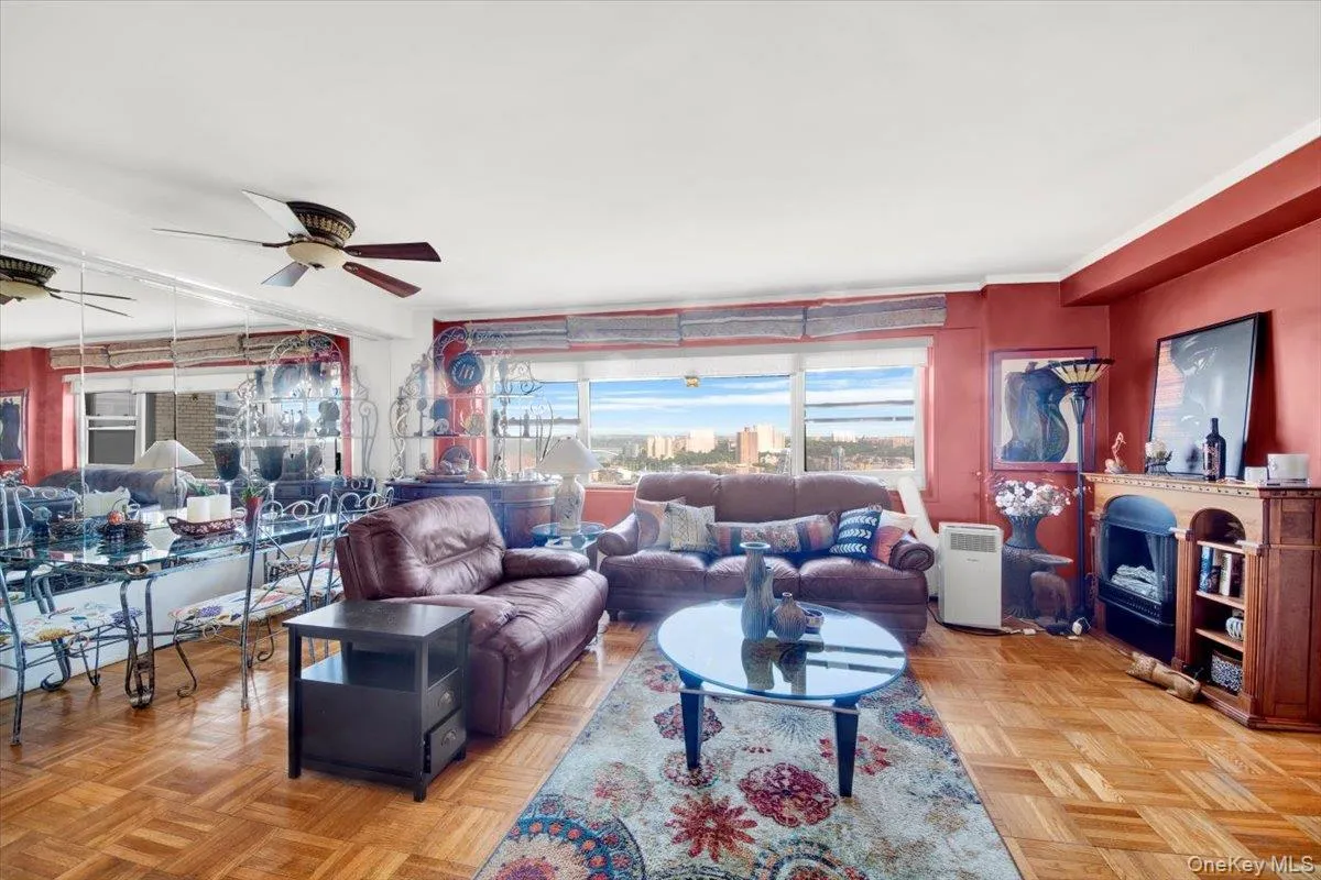 Living room with a fireplace and ceiling fan Living room with a fireplace and ceiling fan