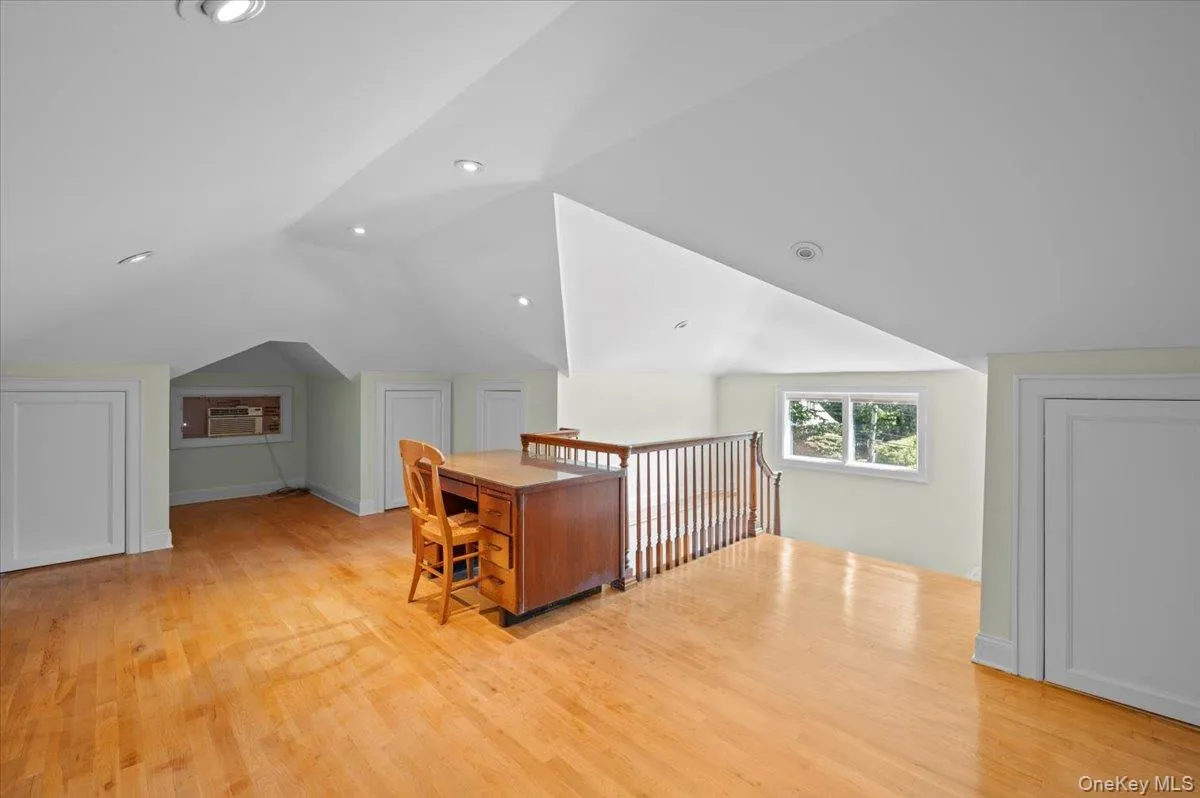 Bonus room with lofted ceiling, light wood-type flooring, and recessed lighting Bonus room with lofted ceiling, light wood-type flooring, and recessed lighting