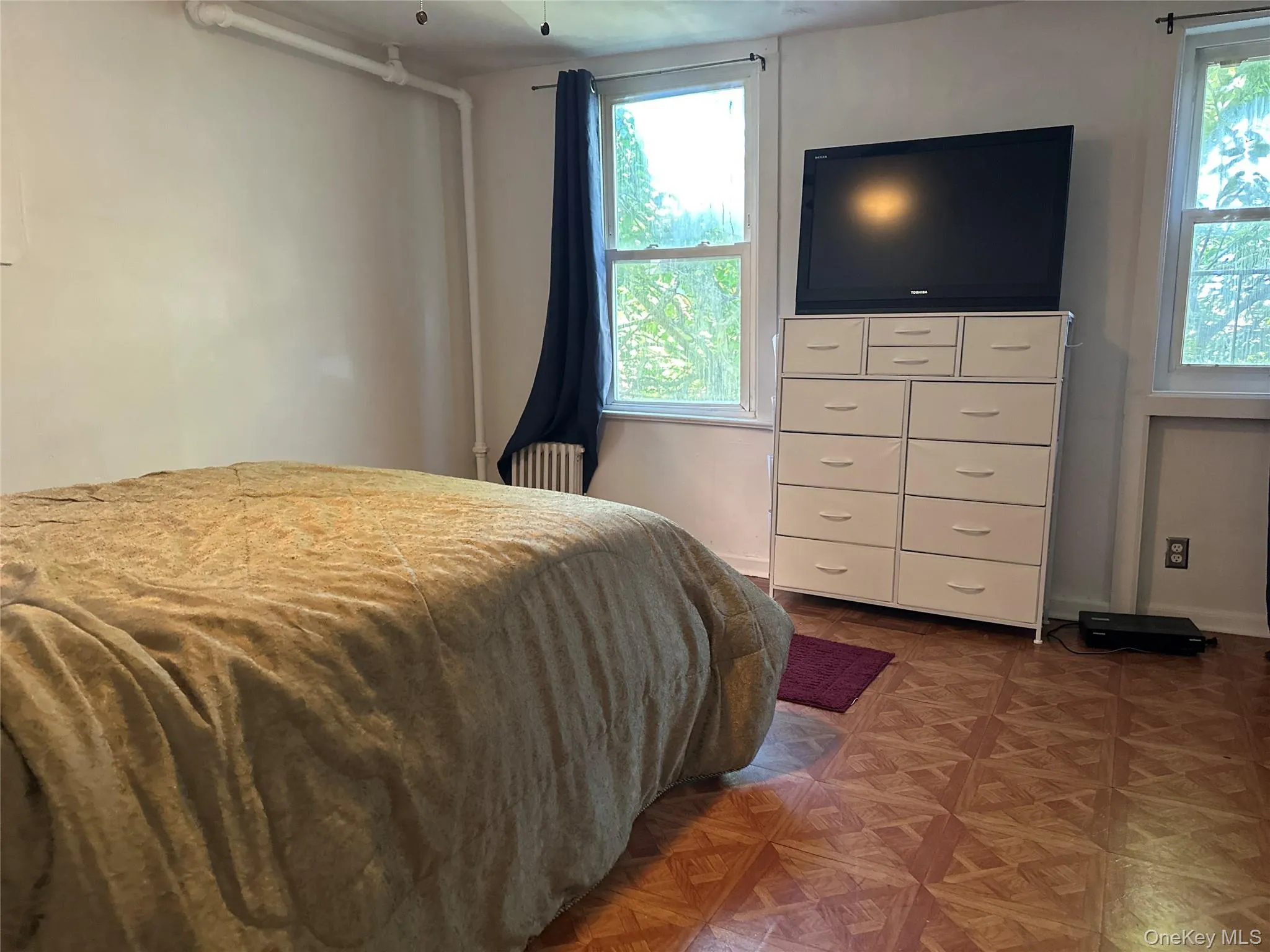 Bedroom featuring radiator Bedroom featuring radiator
